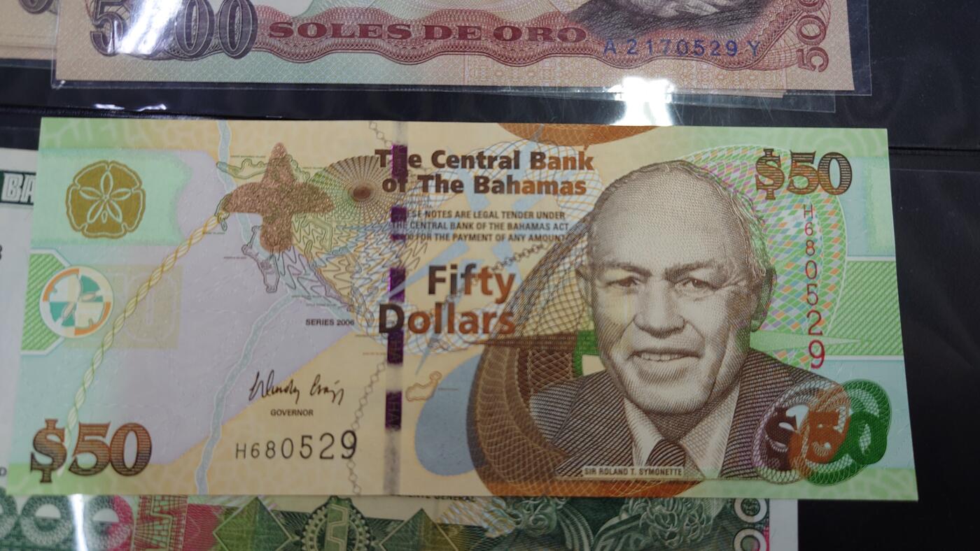 【世界钱币】精选微拍第107期暨2024年第18期  评级币裸钞混合版低价起拍 2006年巴哈马50元 全新绝品无47