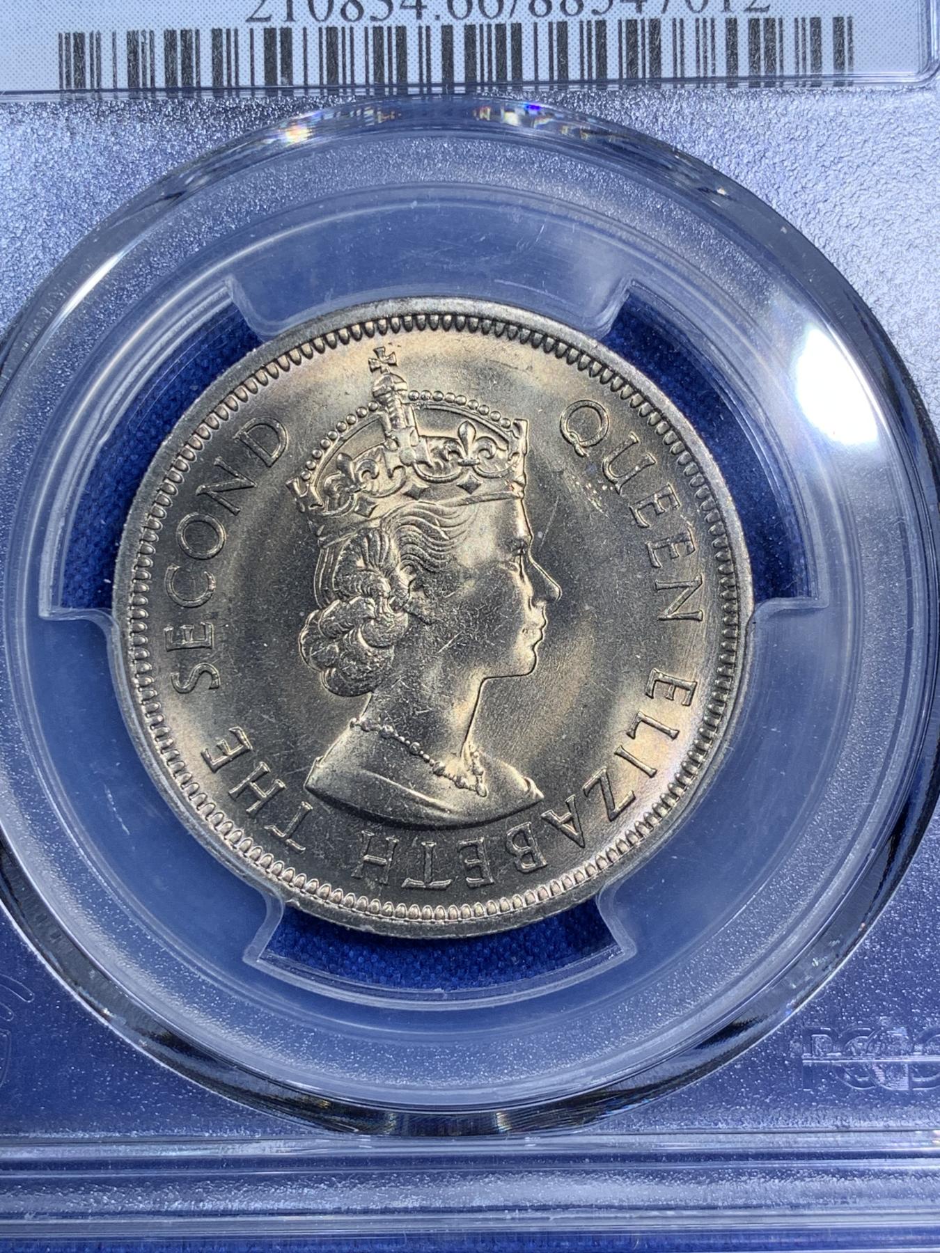 《竞宝斋》第270场- 周日，周一，周二  3场连拍 （全场包邮） PCGS MS66 香港1973年伊丽莎白二世1元大饼 铸造时压力给的过分的充足，头像周围金属被挤压像湖面的涟漪一样扩散，轻微氧化下呈现少见的镍币黄油彩，深色部分呈现桔红色，一卷中最好的即可。