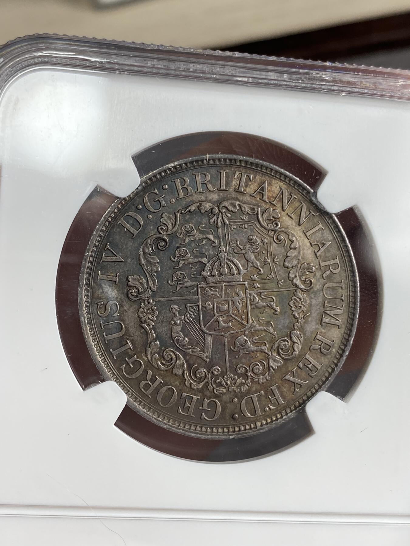 万国钱币拍卖第026期（风云再起·勇士无畏） NGC MS63 1822/1骑字英属西印度1/2D半圆锚币 好品极罕见的英属名誉品种，骑字版本，半圆为全套最大面值，最初是为了毛里求斯和巴巴多斯流通铸造，后来因为贸易需求于1826年发往西印度，双面原味五彩，更高分仅2枚，英属大神REMICK名家旧藏。流传有序。