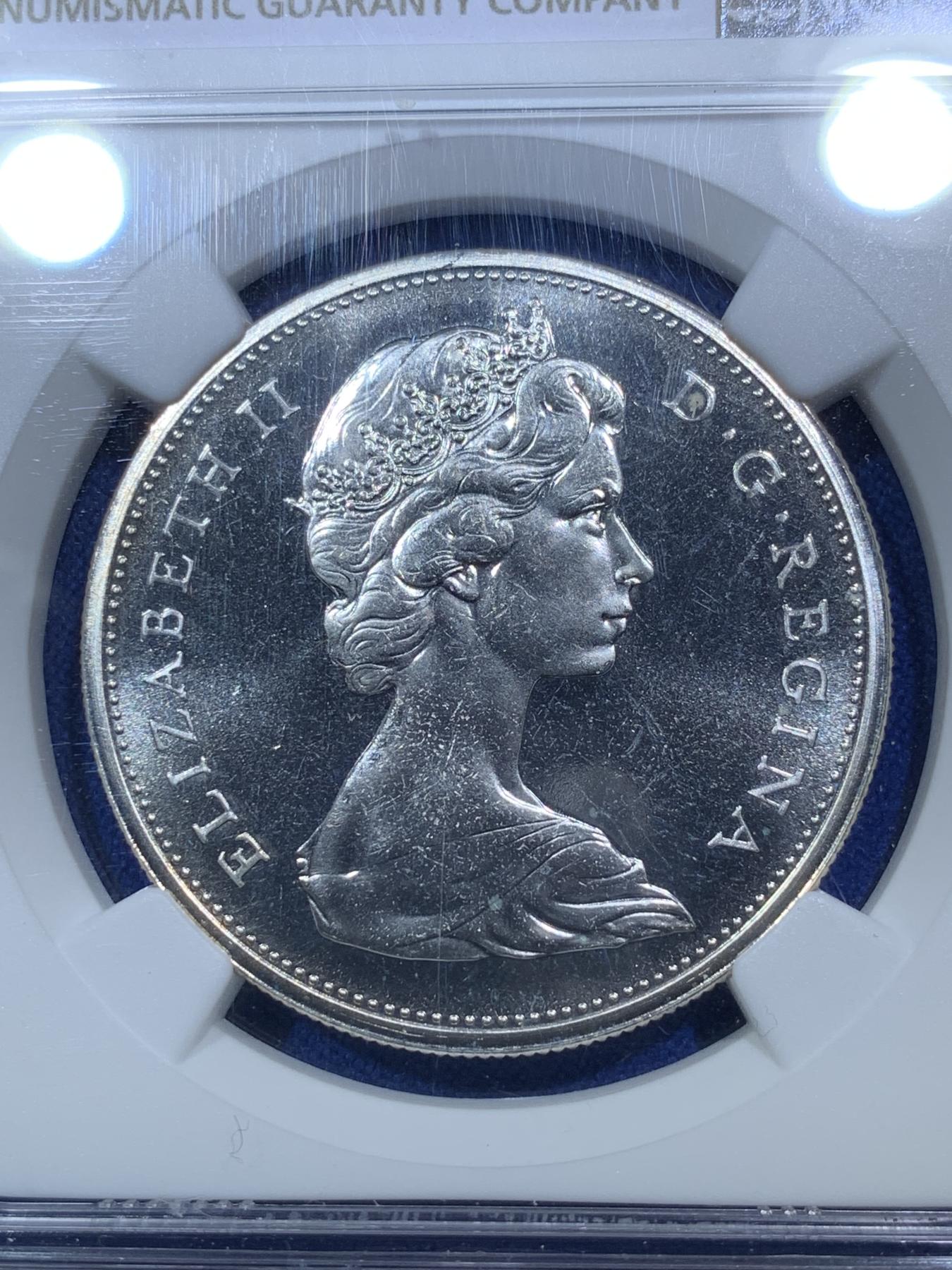 《竞宝斋》第272场- 周日，周一，周二  3场连拍 （全场包邮） NGC PL65 加拿大1965年伊丽莎白二世少妇头像一元划船大银币 小珠子配尖5版别