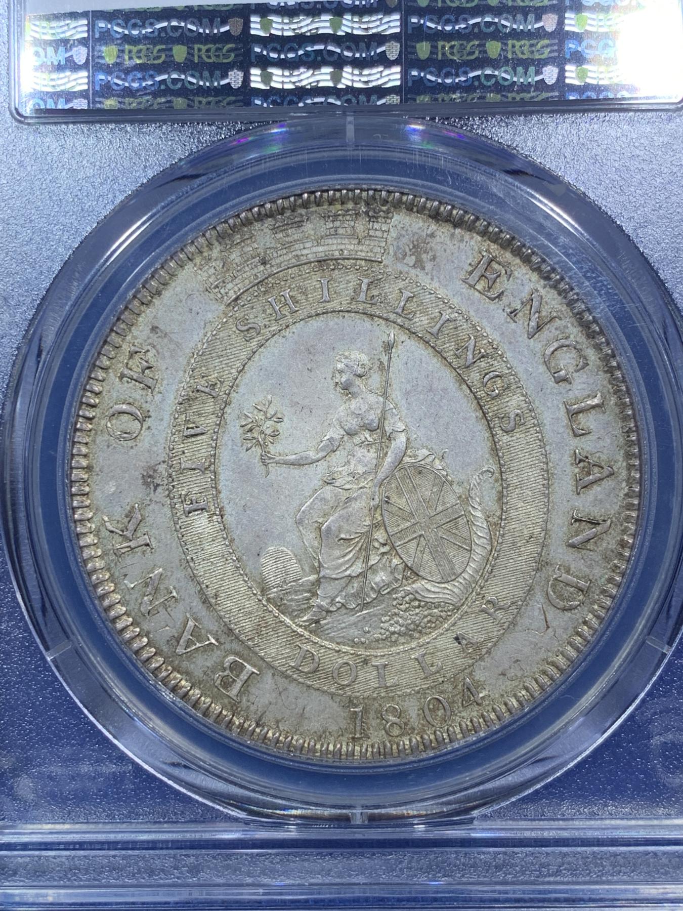 《竞宝斋》第272场- 周日，周一，周二  3场连拍 （全场包邮） PCGS MS62 英国1804乔治三世英格兰银行五先令银币 通体原味深彩包浆 深打 底板的双柱币胚依稀可见 底板丝滑 比一般的62感官上好一些