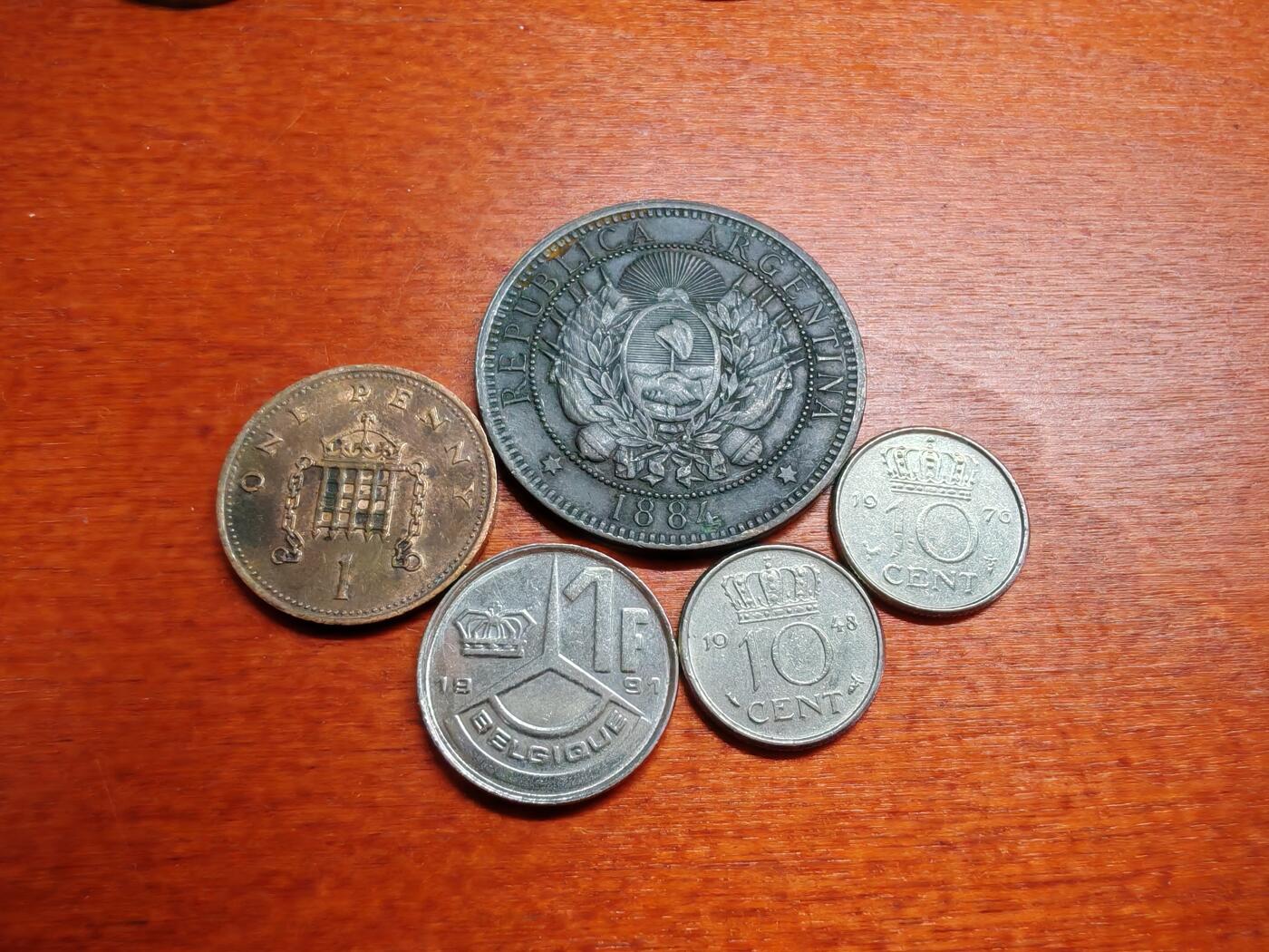 长老汇龙年散币拍卖第一场 1884-1991阿根廷、英国、荷兰、比利时铜镍币，5枚，其中荷兰1948年25分和阿根廷1884年2分是好品