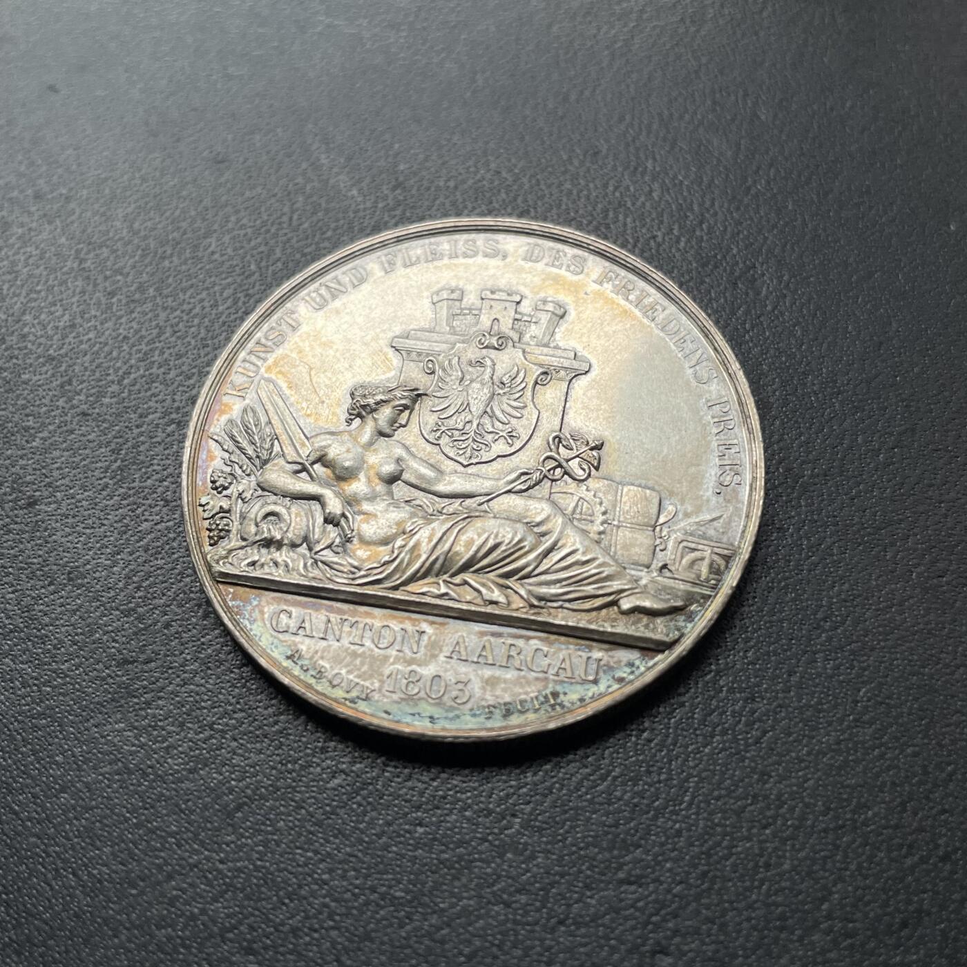 「木头集藏」章牌专场-第42期 1849年瑞士阿尔高射击节银章 直径：37 mm，24 g，瑞士射击节目录1号作品，目录封面章。