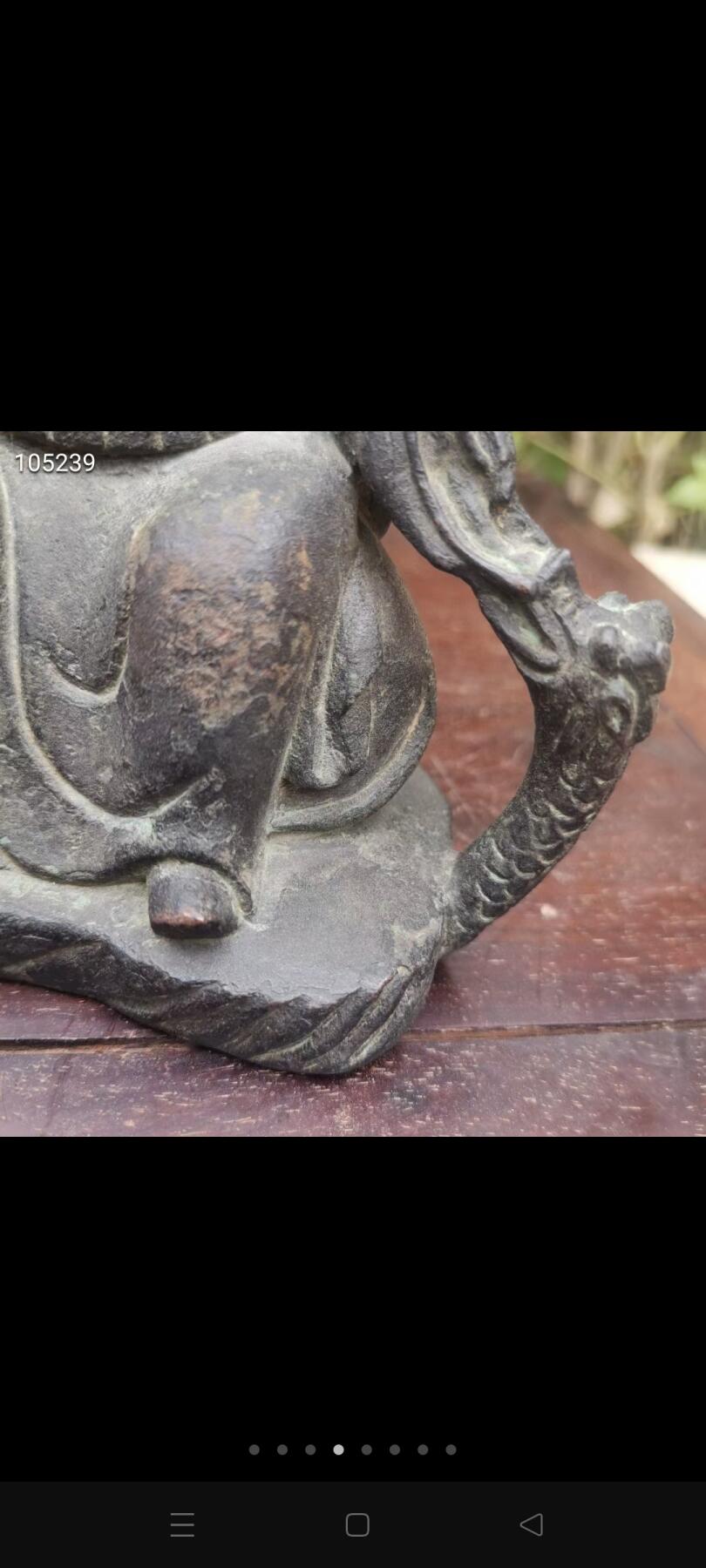 铜佛像一个，品相如图，铁钉做膜，如图可见