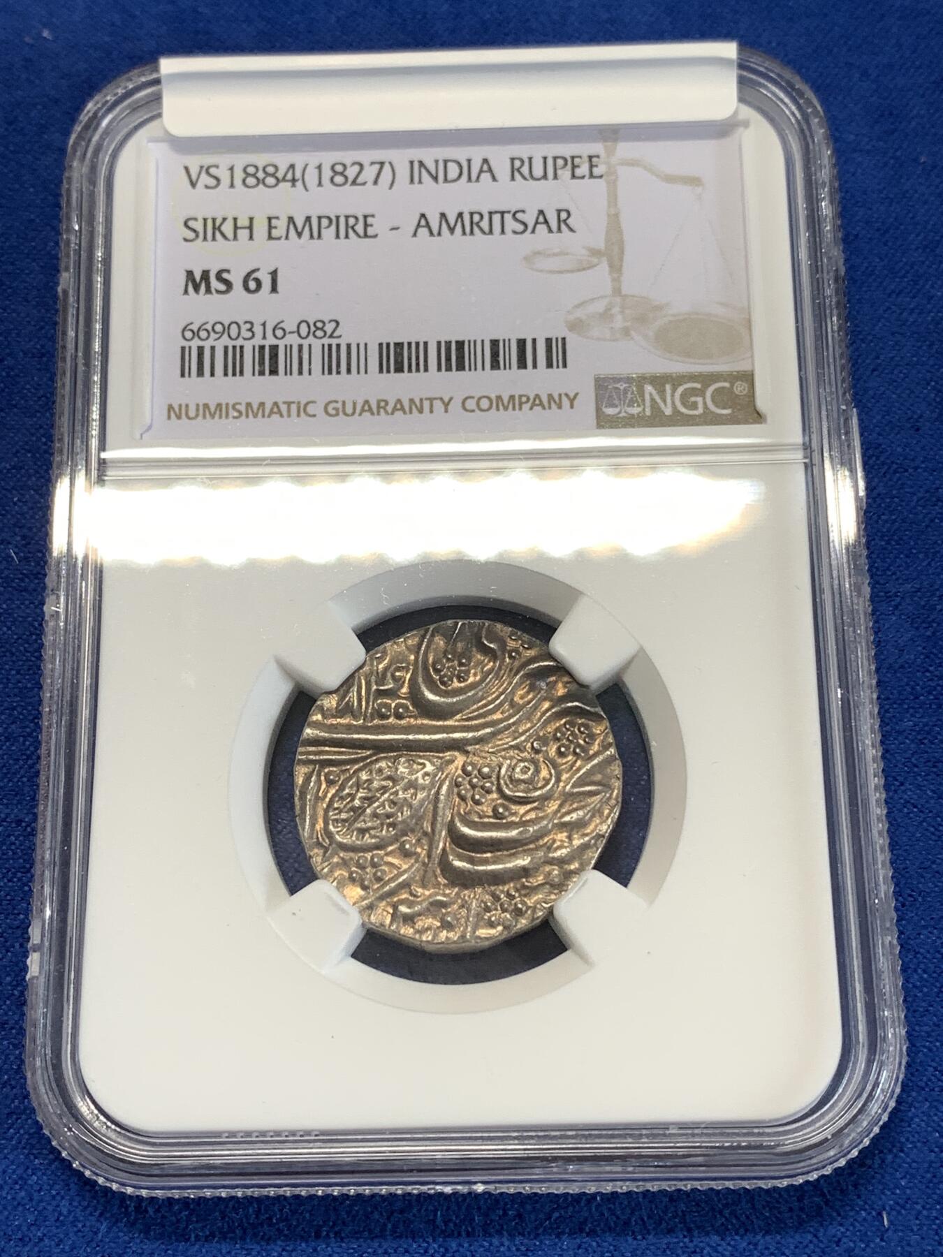 《竞宝斋》第277场- 周日，周一 2场连拍 （全场包邮） NGC MS61 北印度锡克帝国VS1884年（公元1827年）卢比银币 直径约22mm，币重约11克，币文为波斯语，正面为菩提叶和造币地阿姆利则，以及维克拉姆历（V.S.）写就的具体打制年份