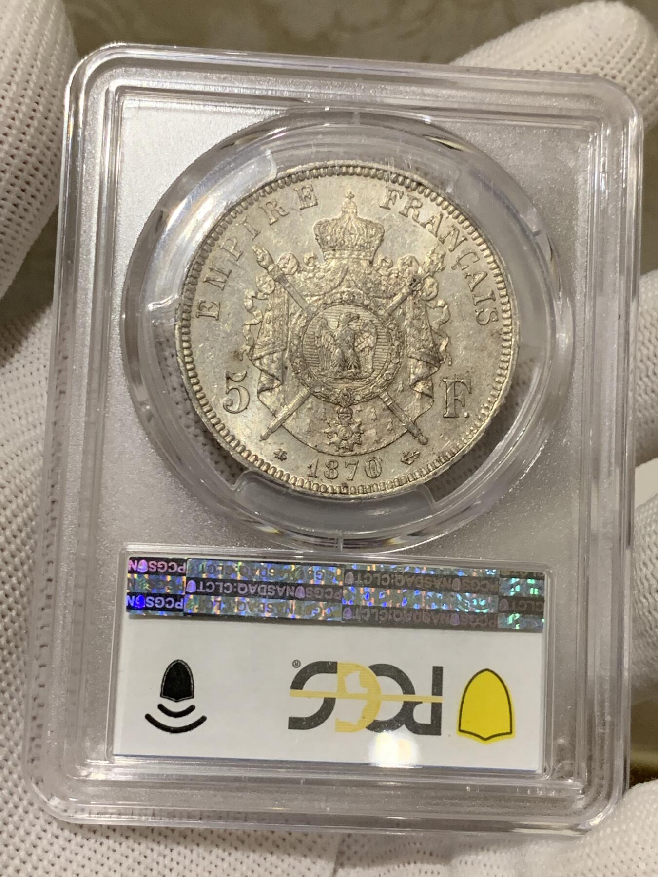 《竞宝斋》第279场- 周日，周一 ，周二3场连拍 （全场包邮） PCGS MS63 法国1870拿破仑三世5法郎银币，末年银币法系算比较好看的设计，法系持续上涨品，高分难得。
