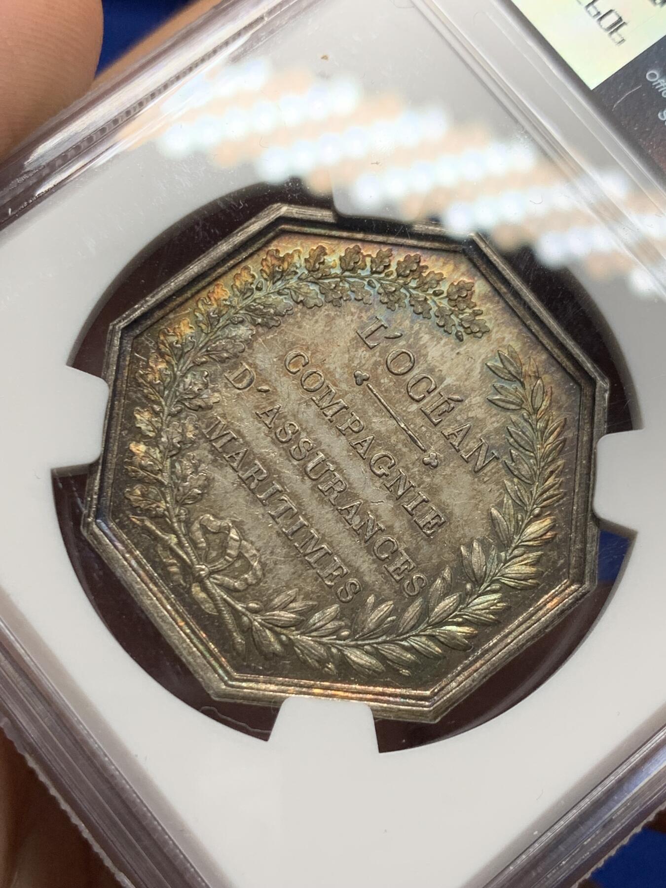 《竞宝斋》第281场- 周日，周一 ，周二3场连拍 （全场包邮） NGC-MS63 法国八角银质代币，海洋保险公司，受到波塞冬庇护的船只行驶在平静的海平面上，非常漂亮的欧洲窖藏五彩