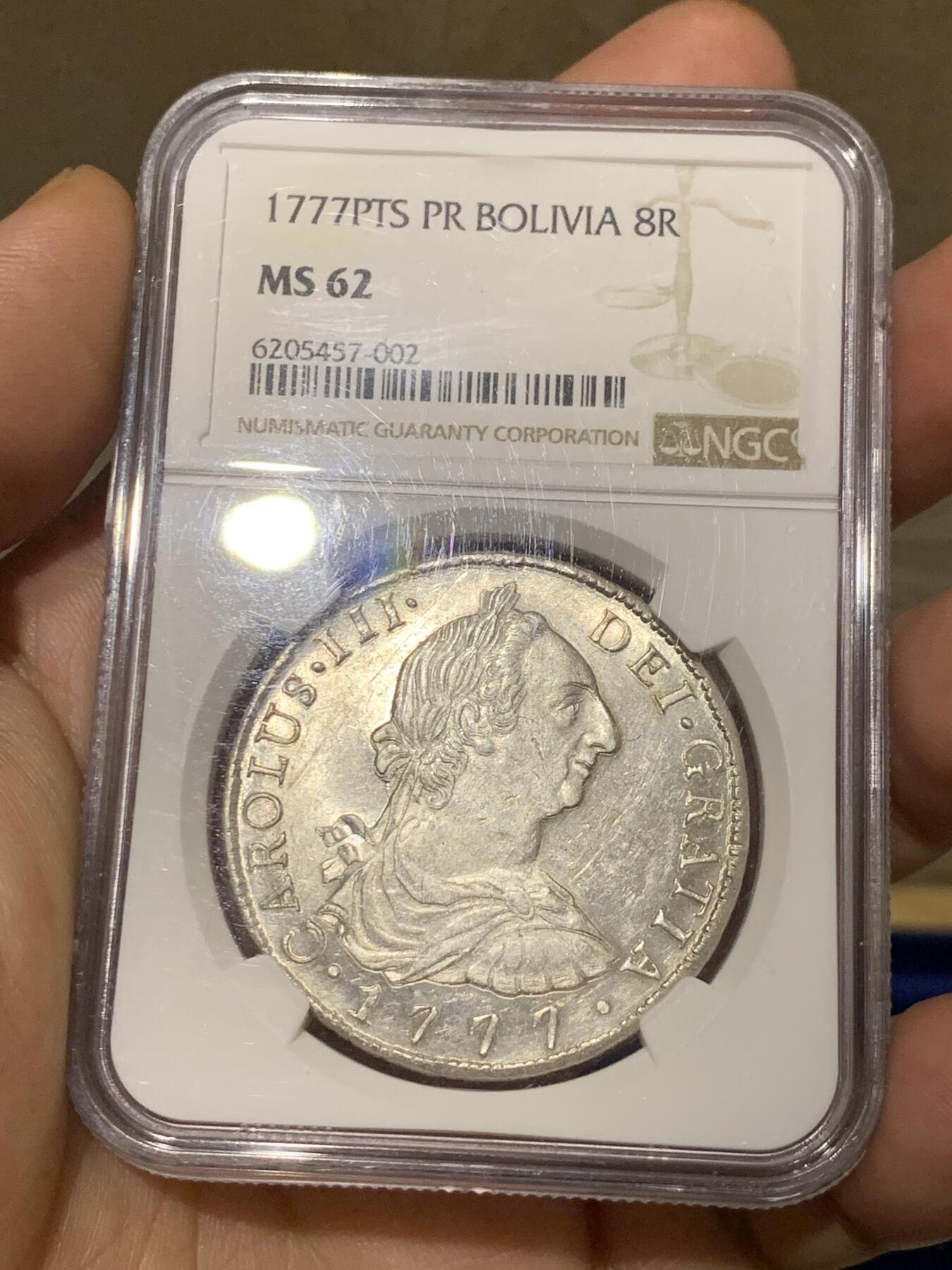 《竞宝斋》第280场- 周日，周一 ，周二3场连拍 （全场包邮） NGC MS62 玻利维亚1777卡三双柱银币 双面深打 底板原光车轮转光 细节近乎完美 外拍大热品种 人像面复打