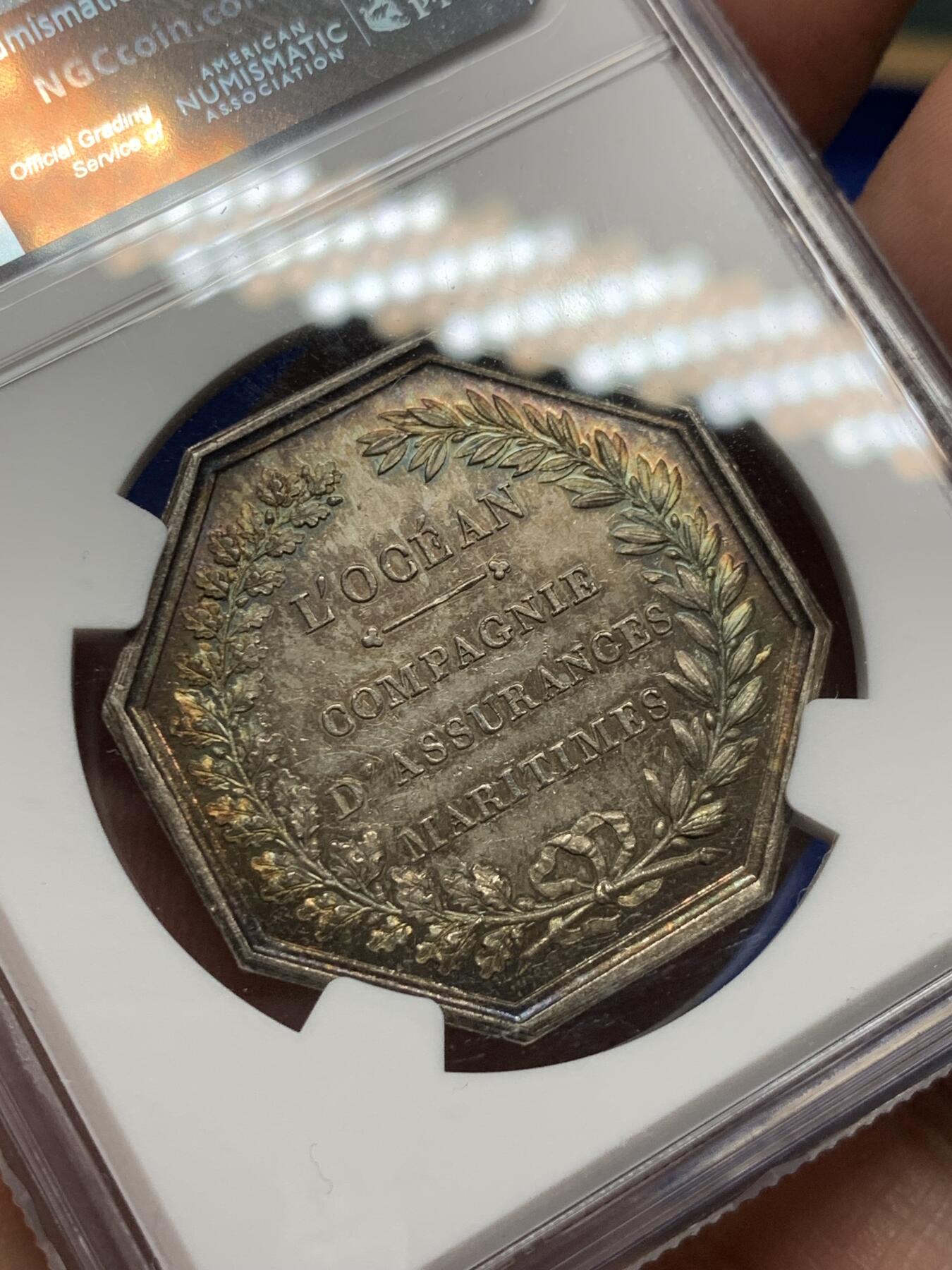 《竞宝斋》第281场- 周日，周一 ，周二3场连拍 （全场包邮） NGC-MS63 法国八角银质代币，海洋保险公司，受到波塞冬庇护的船只行驶在平静的海平面上，非常漂亮的欧洲窖藏五彩