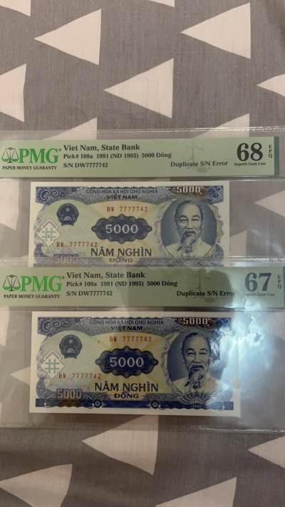 封面主位之二！越南1991年，纸币由中国代印非常严格，同冠同号码理论不存在。越南和中国，包括全球只有6对。本对双胞胎是冠军分。亚军分2个都是66分EPQ I 所以本对双包胎大珍品，没有修补，EPQ高分喜爱越南纸币王座就在眼前。所有玩越南钱币的梦中情钞，及其罕见，可遇而不可求。