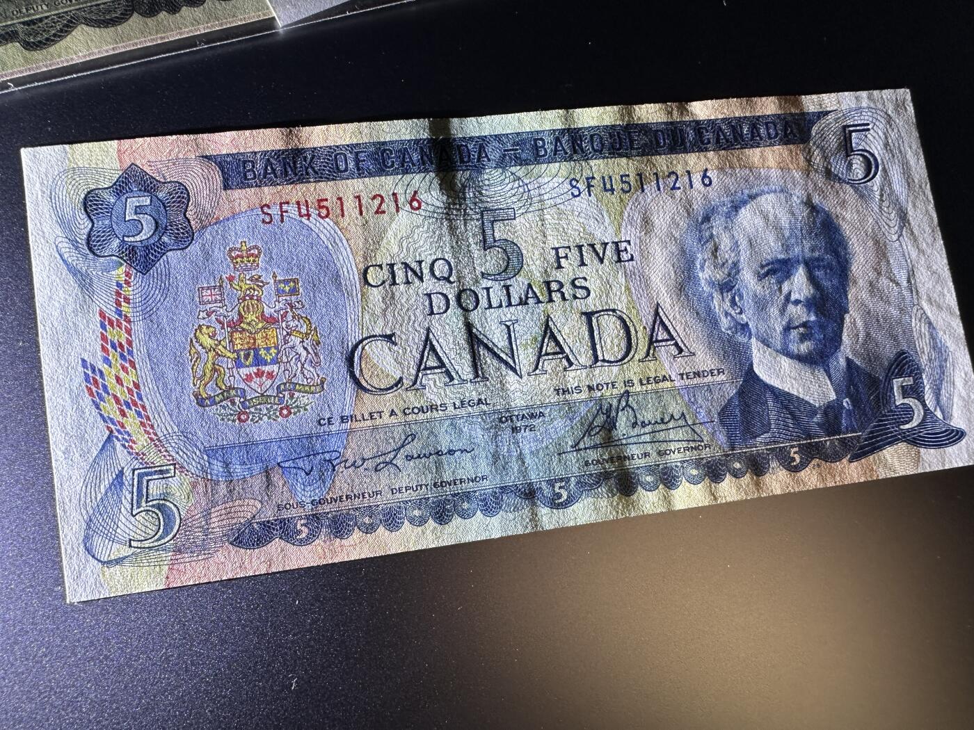 《外钞收藏家》第三百八十一期（美洲小专场） 加拿大1971-74年版小套，1/2/510元，4枚	P85-88 5元轻微几个潮点 有折  其他面额没问题