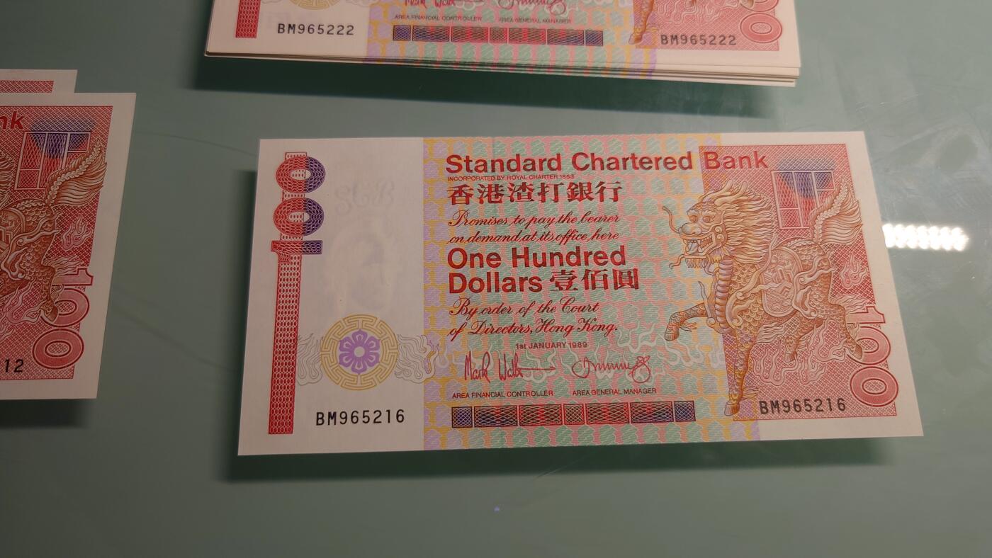 【世界钱币】精选微拍第115期暨2024年第26期  最新维港币展部分卖剩货品展销 1989年香港渣打银行100元 长棍全新绝品无47尾号216