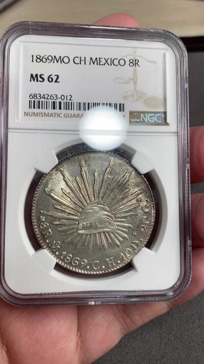 万国钱币拍卖第028期（花前月下●同享良章美币） NGC MS62 1869年墨西哥MO厂8R鹰洋 中期十字转光