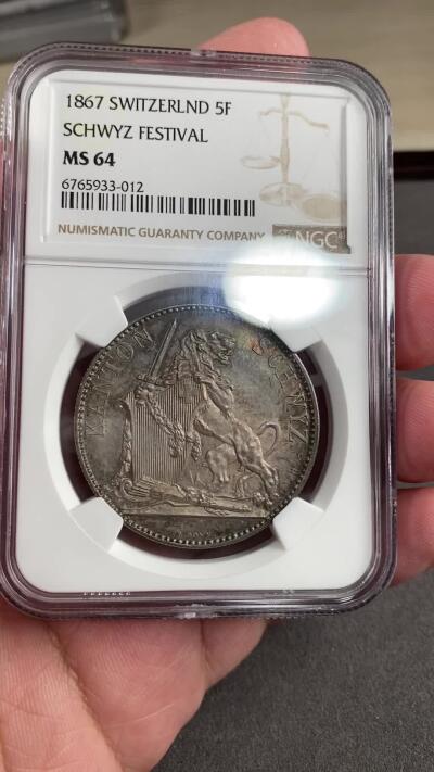 万国钱币拍卖第028期（花前月下●同享良章美币） NGC MS64 1867年瑞士施维茨射击节5法郎大银币 渐变青蓝色玫瑰金彩  瑞射5法郎中的难点之一