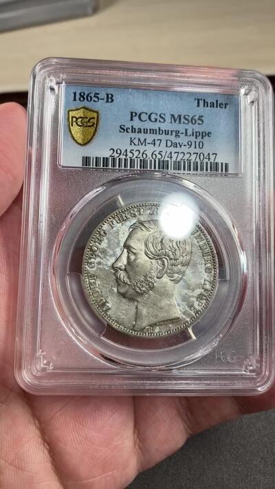 万国钱币拍卖第028期（花前月下●同享良章美币） PCGS MS65 1865年德国绍姆堡-利普天使1泰勒 单年发行7000枚的小邦天使泰勒 汉诺威厂的巅峰之作 无论彩虹般的包浆还是镜子般的底板都将这枚泰勒勾勒为完美的完全体收藏品 PCGS唯二冠军分