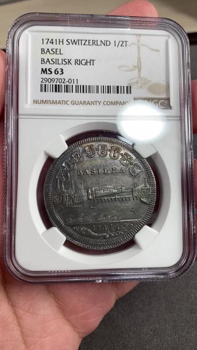 万国钱币拍卖第028期（花前月下●同享良章美币） NGC MS63 1741年瑞士巴赛尔景观1/2泰勒 全深打+重五彩巴赛尔景观可谓凤毛麟角 常见的减重痕也未出现 此枚可谓收藏精品