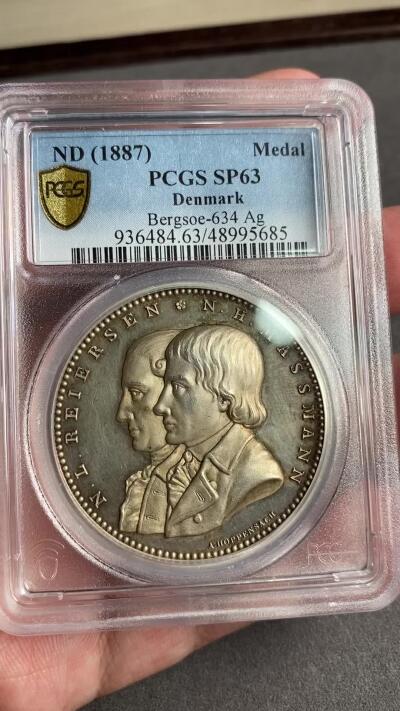 万国钱币拍卖第028期（花前月下●同享良章美币） PCGS SP63 唯一记录1887年丹麦汉斯-马斯曼主日学校银质大奖章，加厚评级盒！超厚重的北欧大银章，背面勤学的小天使图案非常可爱 。42MM 44G