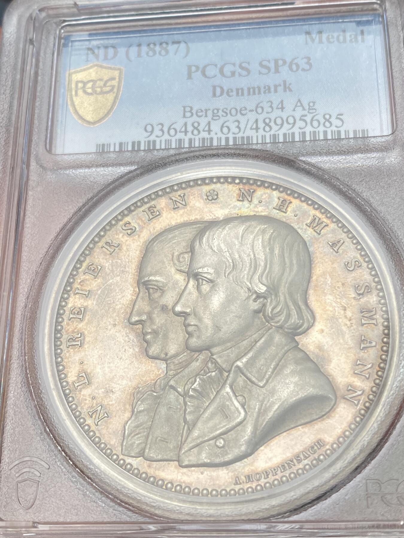 万国钱币拍卖第028期（花前月下●同享良章美币） PCGS SP63 唯一记录1887年丹麦汉斯-马斯曼主日学校银质大奖章，加厚评级盒！超厚重的北欧大银章，背面勤学的小天使图案非常可爱 。42MM 44G