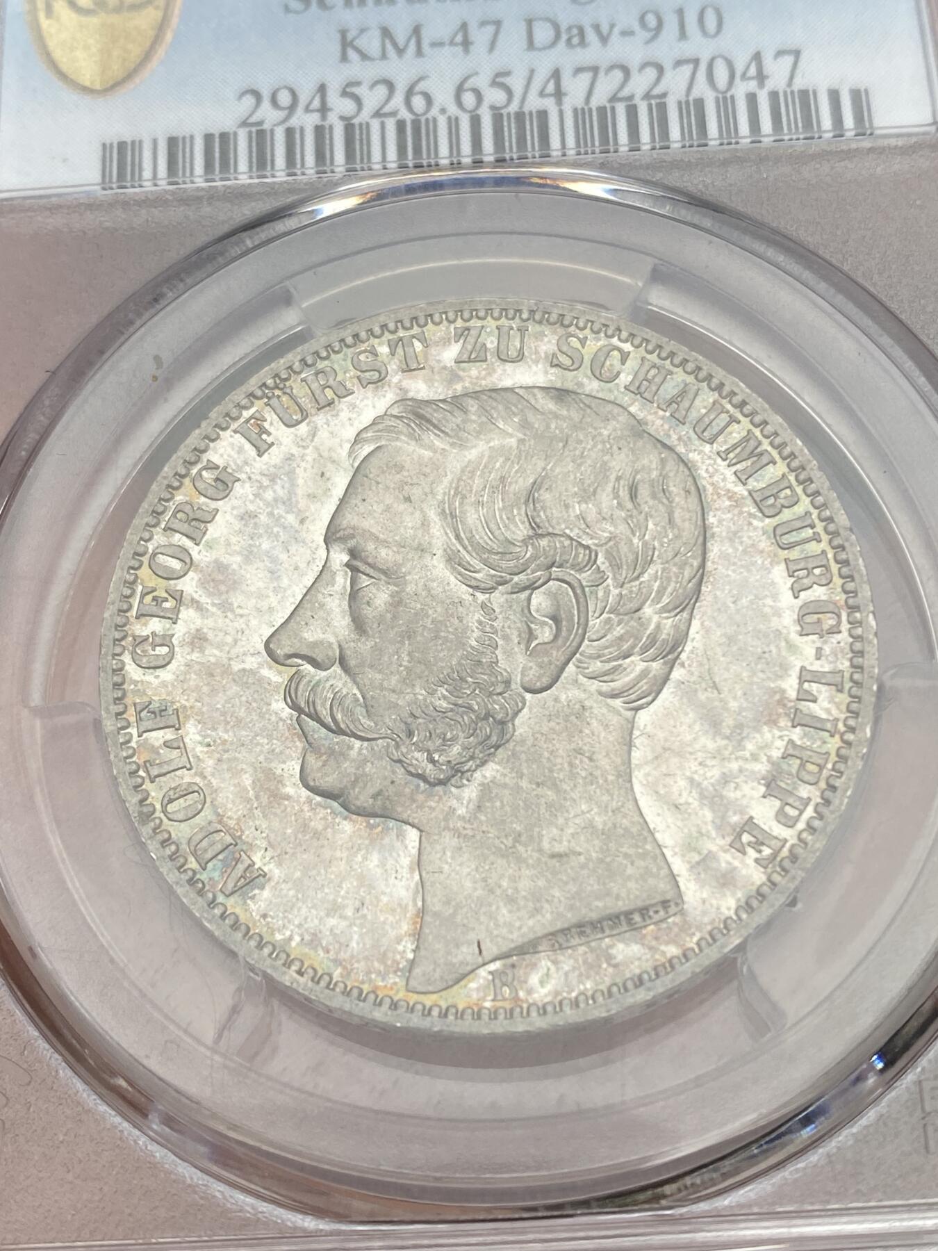 万国钱币拍卖第028期（花前月下●同享良章美币） PCGS MS65 1865年德国绍姆堡-利普天使1泰勒 单年发行7000枚的小邦天使泰勒 汉诺威厂的巅峰之作 无论彩虹般的包浆还是镜子般的底板都将这枚泰勒勾勒为完美的完全体收藏品 PCGS唯二冠军分