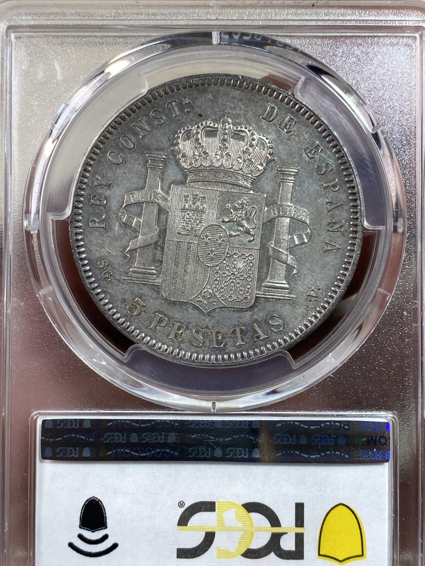 万国钱币拍卖第028期（花前月下●同享良章美币） PCGS MS63 1899年西班牙5比塞塔大银币 经典男童设计，海格力斯双柱。通体原味虹彩包浆，车轮光打制优异底板佳。实物非常漂亮，远超白板的视觉享受，也没有一般63的伤痕累累。评分略微保守，作为流通币保存状态相当不错。相对少见的年份，值得收藏的热门西班牙大银。