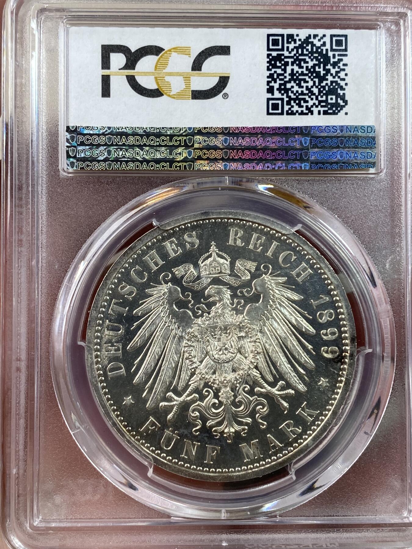 万国钱币拍卖第028期（花前月下●同享良章美币） PCGS PR65CAM 1899年德国威廉二世长翅精制5马克 难度极大的精制年份，底板光洁如镜，和喷砂人像形成鲜明对比，PC唯一精制记录，NGC也仅有两枚且最高分为64，真正难寻其二的藏品。
