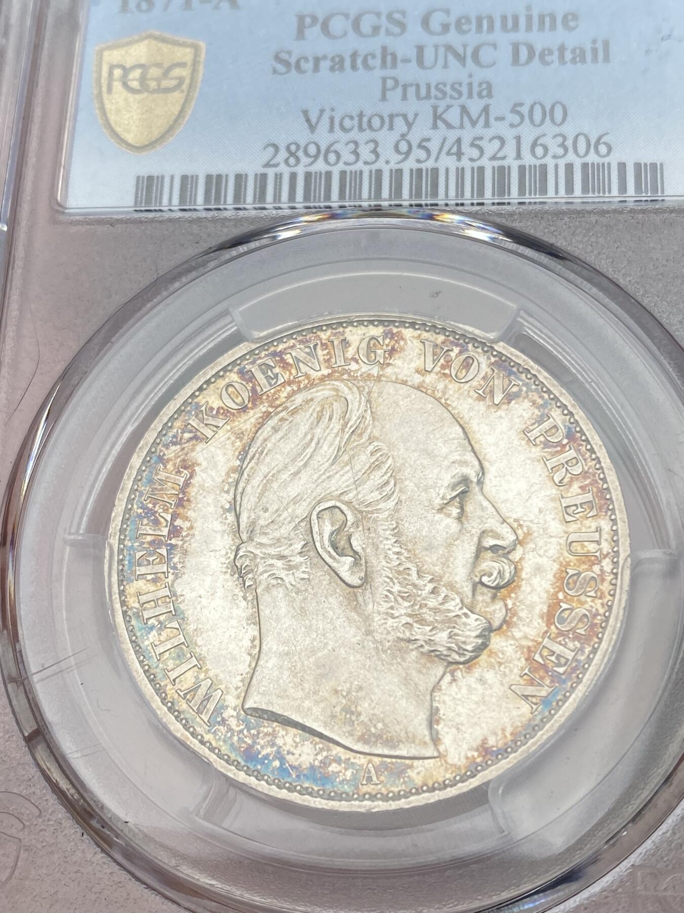 万国钱币拍卖第028期（花前月下●同享良章美币） PCGS UNCD 1871年德国普鲁士普法战争胜利1泰勒 高点表现不错 有清洗痕迹 整体呈镜面状态