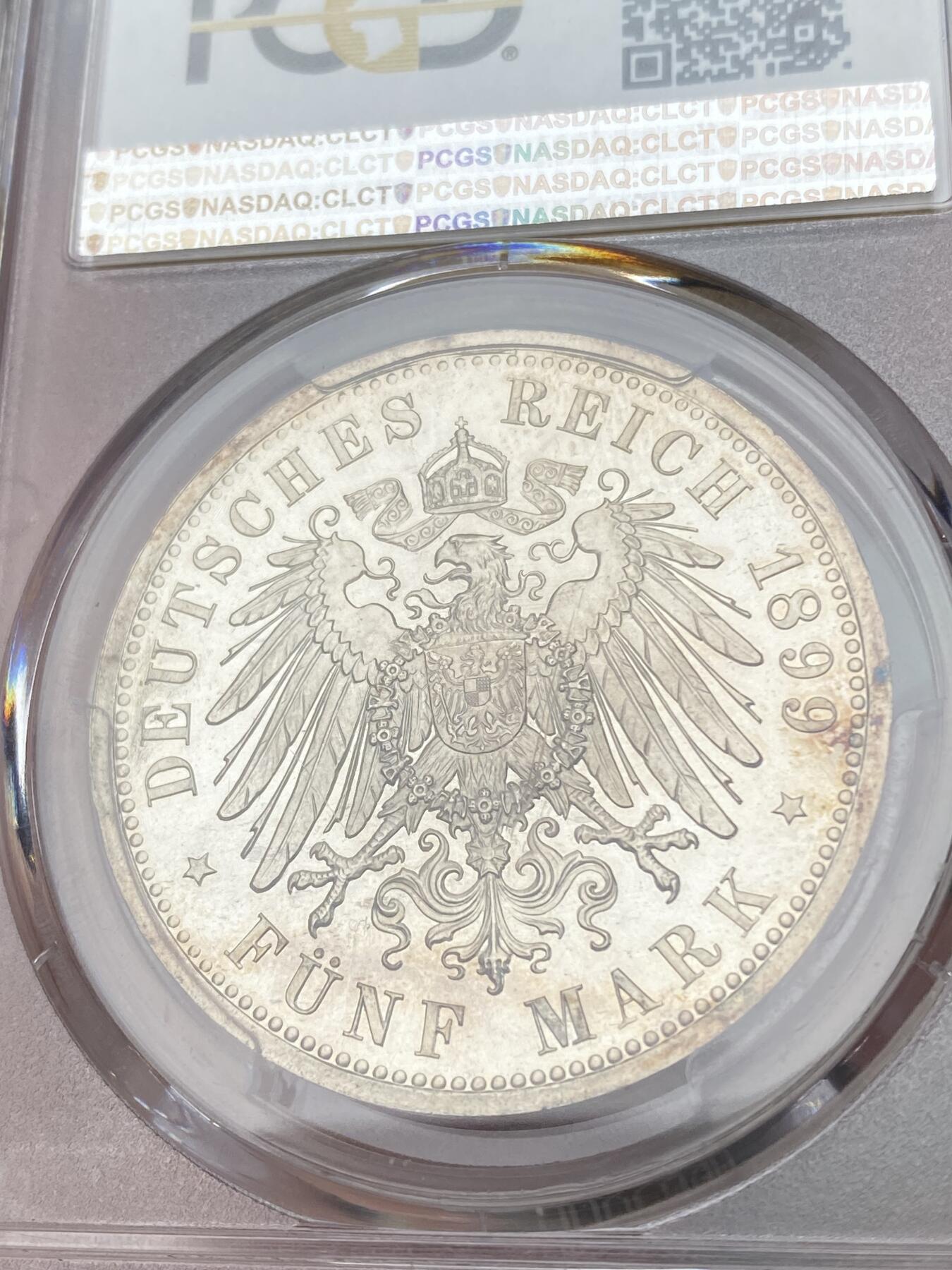 万国钱币拍卖第028期（花前月下●同享良章美币） PCGS PR65CAM 1899年德国威廉二世长翅精制5马克 难度极大的精制年份，底板光洁如镜，和喷砂人像形成鲜明对比，PC唯一精制记录，NGC也仅有两枚且最高分为64，真正难寻其二的藏品。