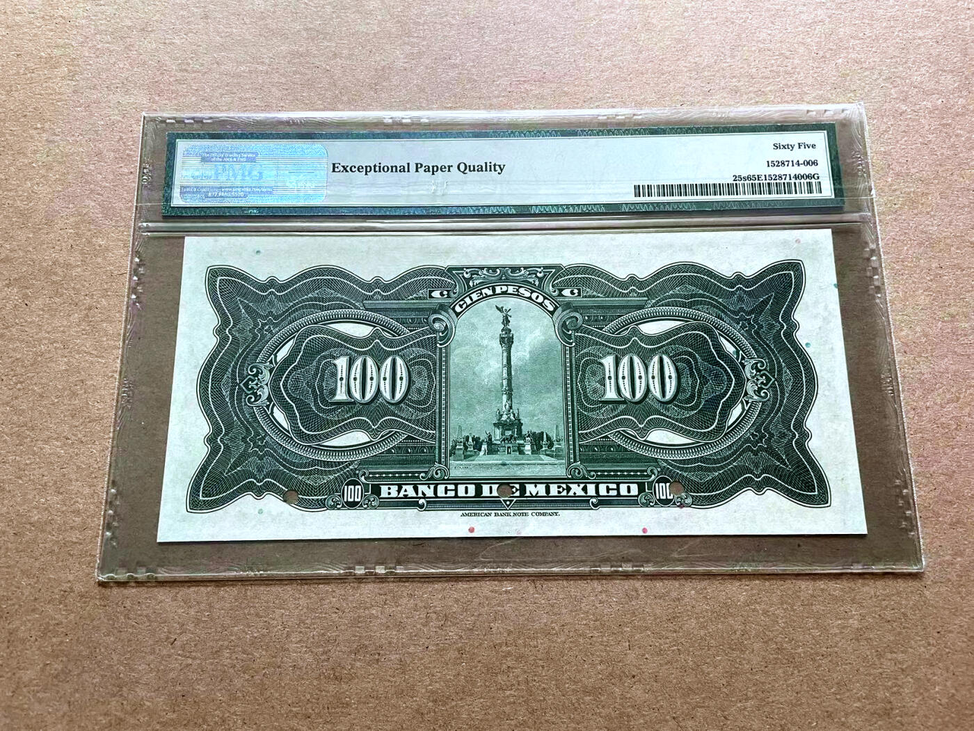 【Blue Auction】✨世界纸币精拍第500期盛典——白金之夜🔥🔥🔥 M-墨西哥 1925-34年100比索 PMG65EPQ ABNC出品 样钞 正面是加拿大100元纸币背面的经典图案，雕刻非常精美。背面是位于墨西哥城的独立纪念柱，于1910年9月16日墨西哥独立战争100周年落成，由墨西哥建筑师和法国雕刻家合作完成的，它是墨西哥人民独立精神的象征，也是墨西哥人民反对外来侵略者、争取民族独立的胜利标志。