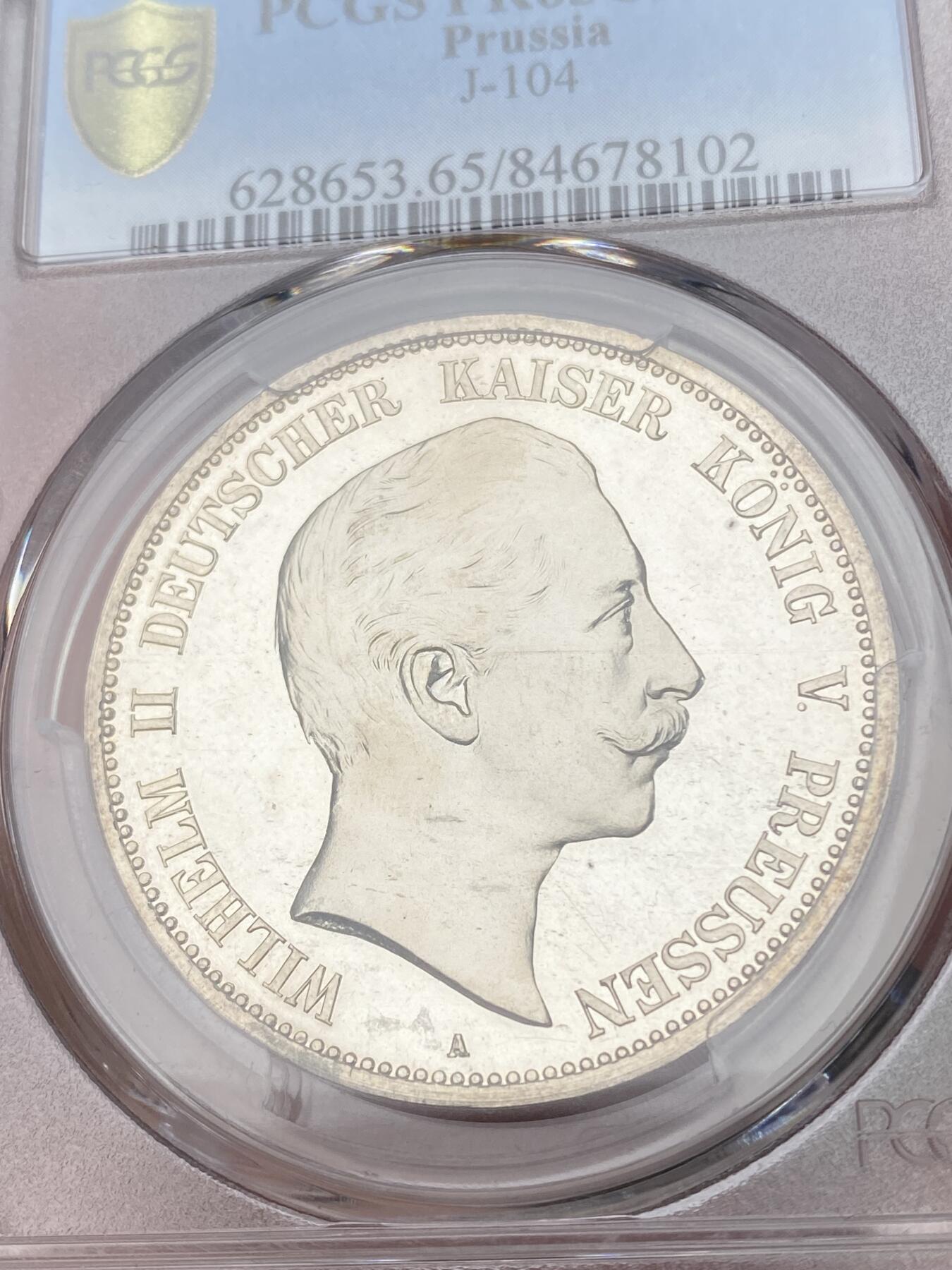 万国钱币拍卖第028期（花前月下●同享良章美币） PCGS PR65CAM 1899年德国威廉二世长翅精制5马克 难度极大的精制年份，底板光洁如镜，和喷砂人像形成鲜明对比，PC唯一精制记录，NGC也仅有两枚且最高分为64，真正难寻其二的藏品。