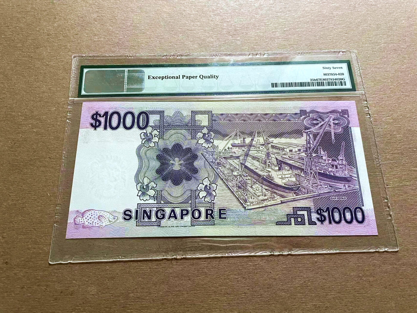 【Blue Auction】✨世界纸币精拍第500期盛典——白金之夜🔥🔥🔥 S-新加坡 1984年1000元高值 PMG67EPQ 高分 正面海王星石榴石号集装箱船是当时世界上最大的集装箱船之一 非常漂亮