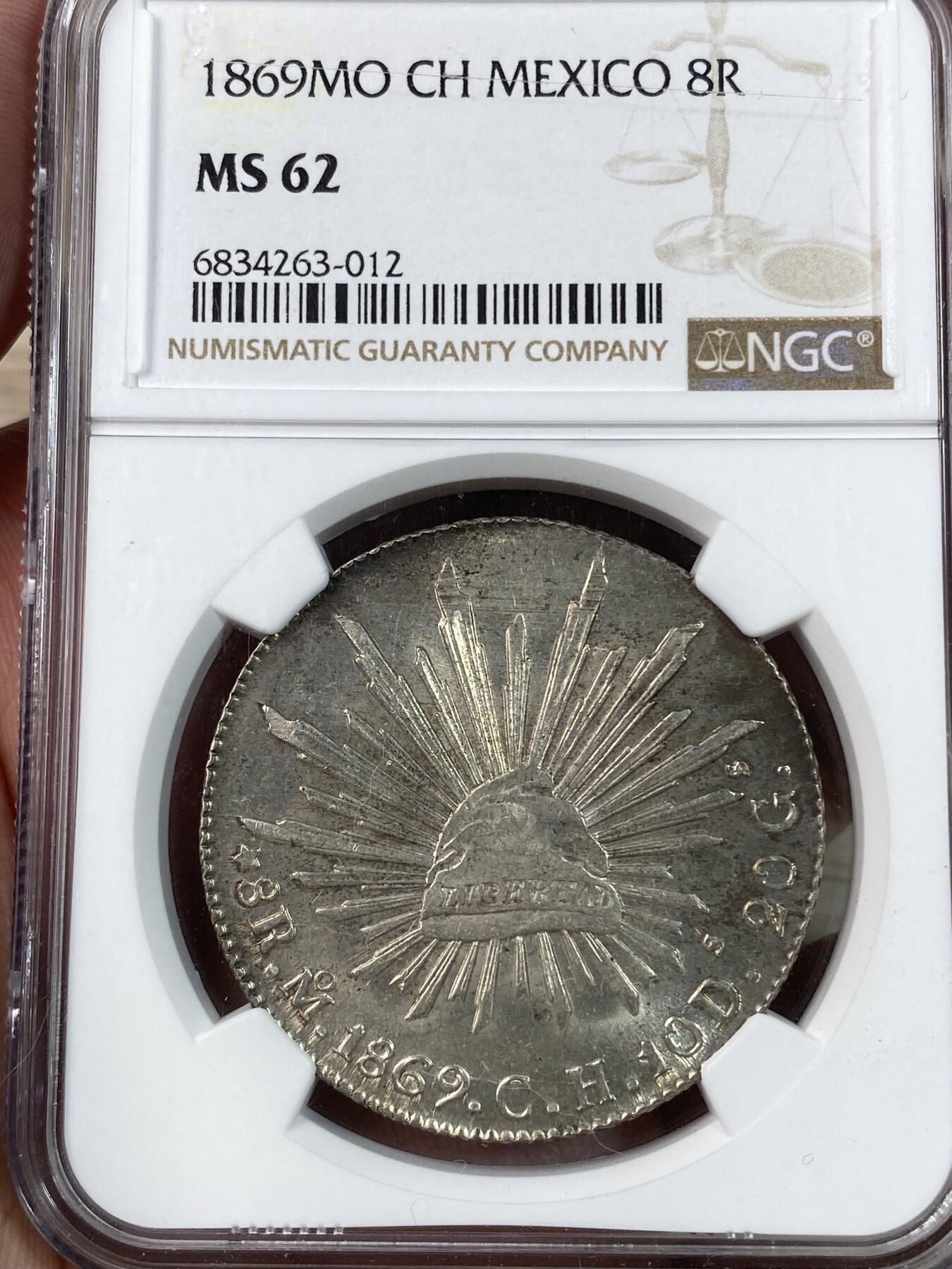 万国钱币拍卖第028期（花前月下●同享良章美币） NGC MS62 1869年墨西哥MO厂8R鹰洋 中期十字转光