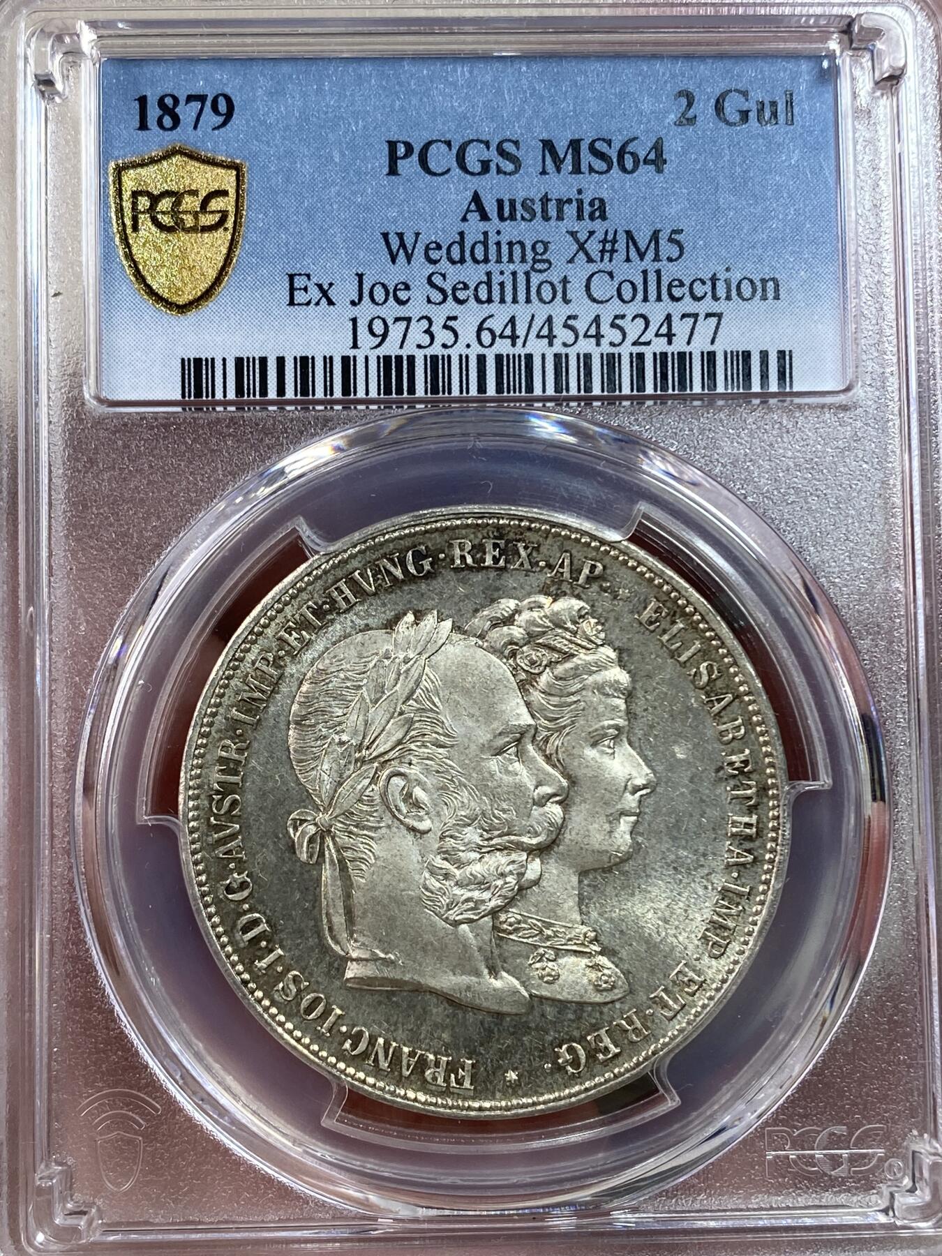 万国钱币拍卖第028期（花前月下●同享良章美币） PCGS MS64 1879年奥地利佛朗茨一世与茜茜公主银婚纪念2盾 顶级BU状态，淡金彩包浆，强流银霜光，pl感强烈，实物炫目，万里挑一的品质。