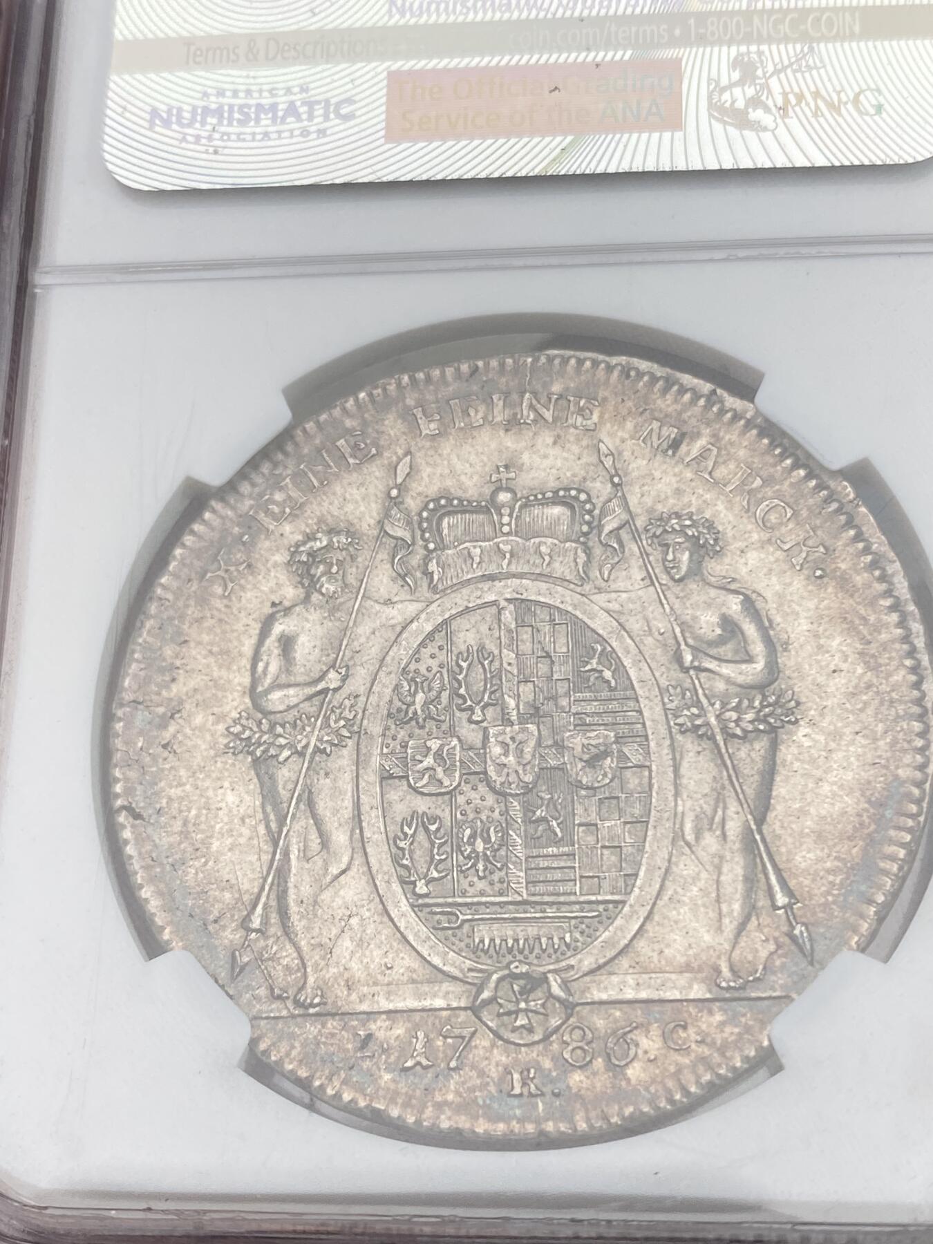 万国钱币拍卖第028期（花前月下●同享良章美币） NGC MS62 1786年德国施瓦茨堡-鲁多尔施塔特野人皇冠大泰勒 爆炸品种 MS极其难得 细节有多棒可通过野人及邦徽等精细部位一窥一二