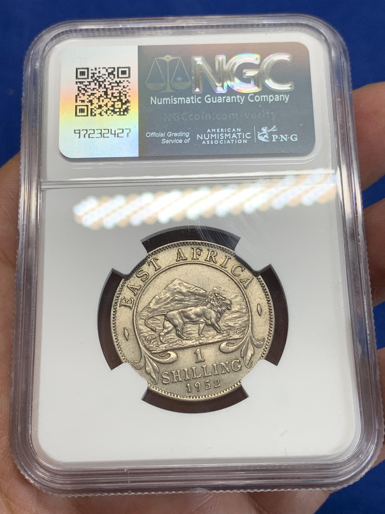 《竞宝斋》第284场- 周日，周一 2场连拍 （全场包邮） NGC MS62 英属东非1952年1先令镍币 很少见的品种 工艺问题 62分已经是很不错的分数了 面值面狮子栩栩如生 细节非常好