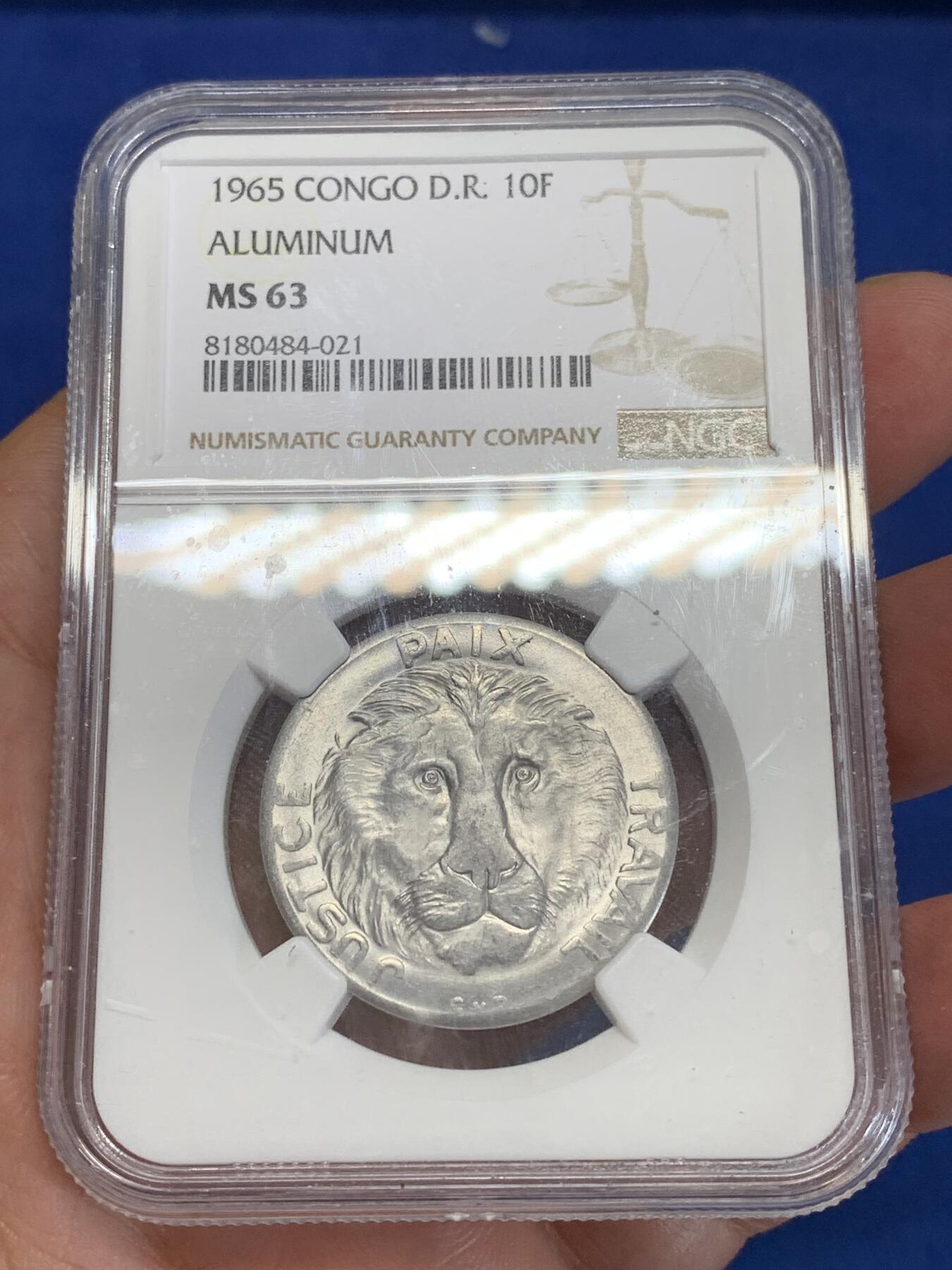 《竞宝斋》第284场- 周日，周一 2场连拍 （全场包邮） NGC MS63 刚果1965年10法郎铝币 大热品种 狮子图案非常受欢迎 铝币这个品相已经非常不容易了 两面都带转光 细节极好
