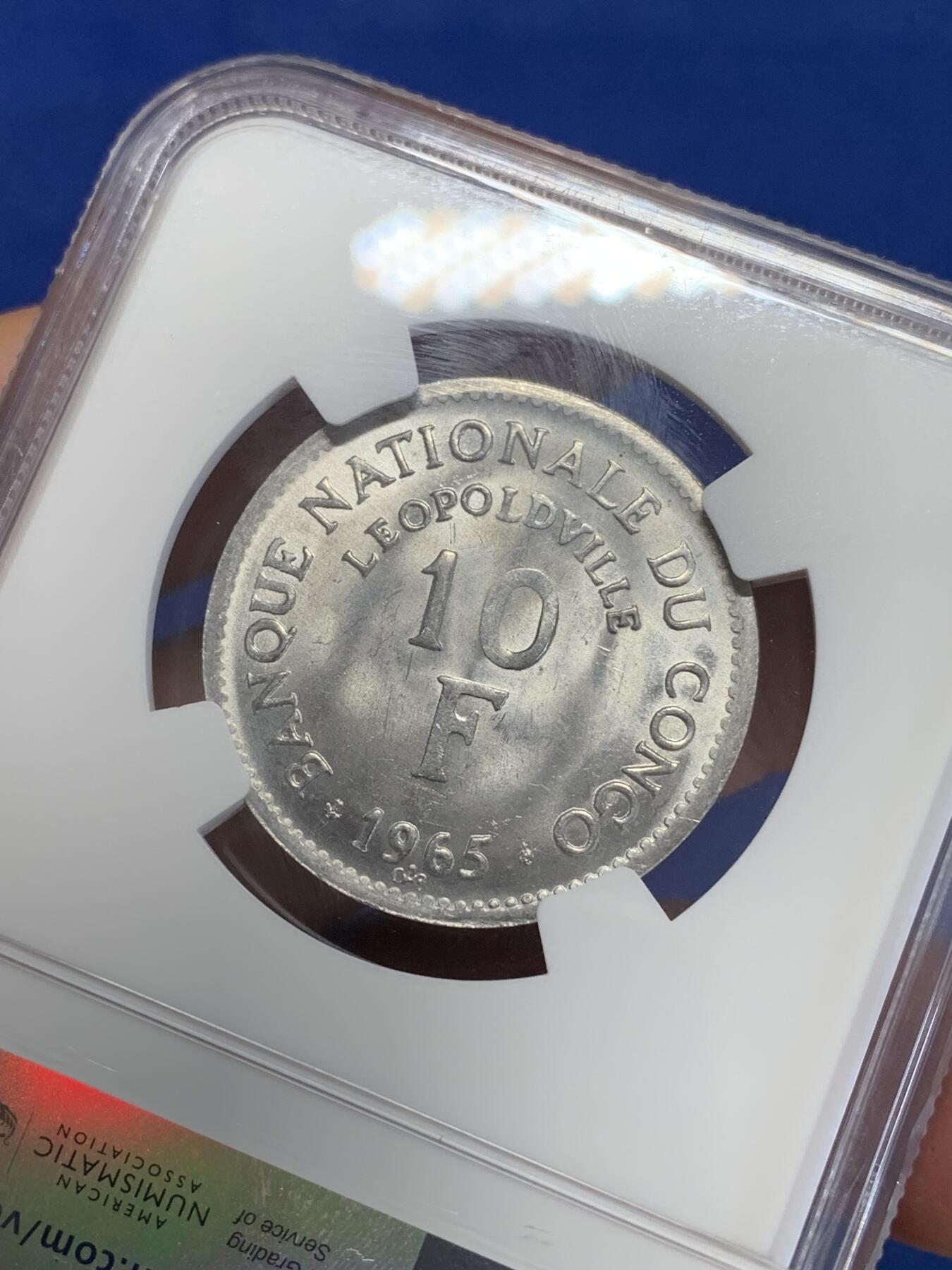 《竞宝斋》第284场- 周日，周一 2场连拍 （全场包邮） NGC MS63 刚果1965年10法郎铝币 大热品种 狮子图案非常受欢迎 铝币这个品相已经非常不容易了 两面都带转光 细节极好