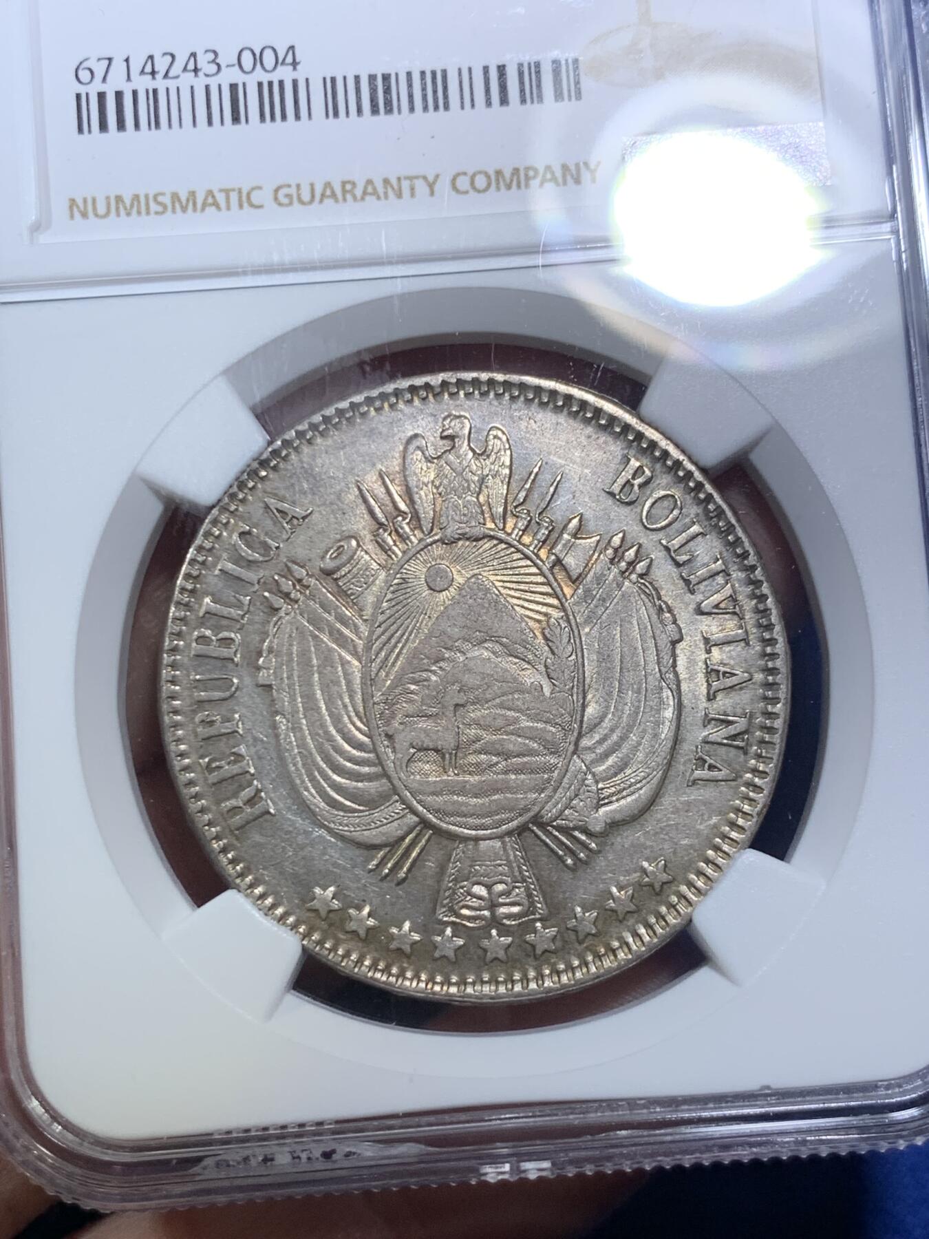 《竞宝斋》第285场- 周日，周一 2场连拍 （全场包邮） NGC AU55 玻利维亚1864年1玻大银币 该版首发年份，不是常见后期年份，好品很少，快速上涨的南美币品种，低评