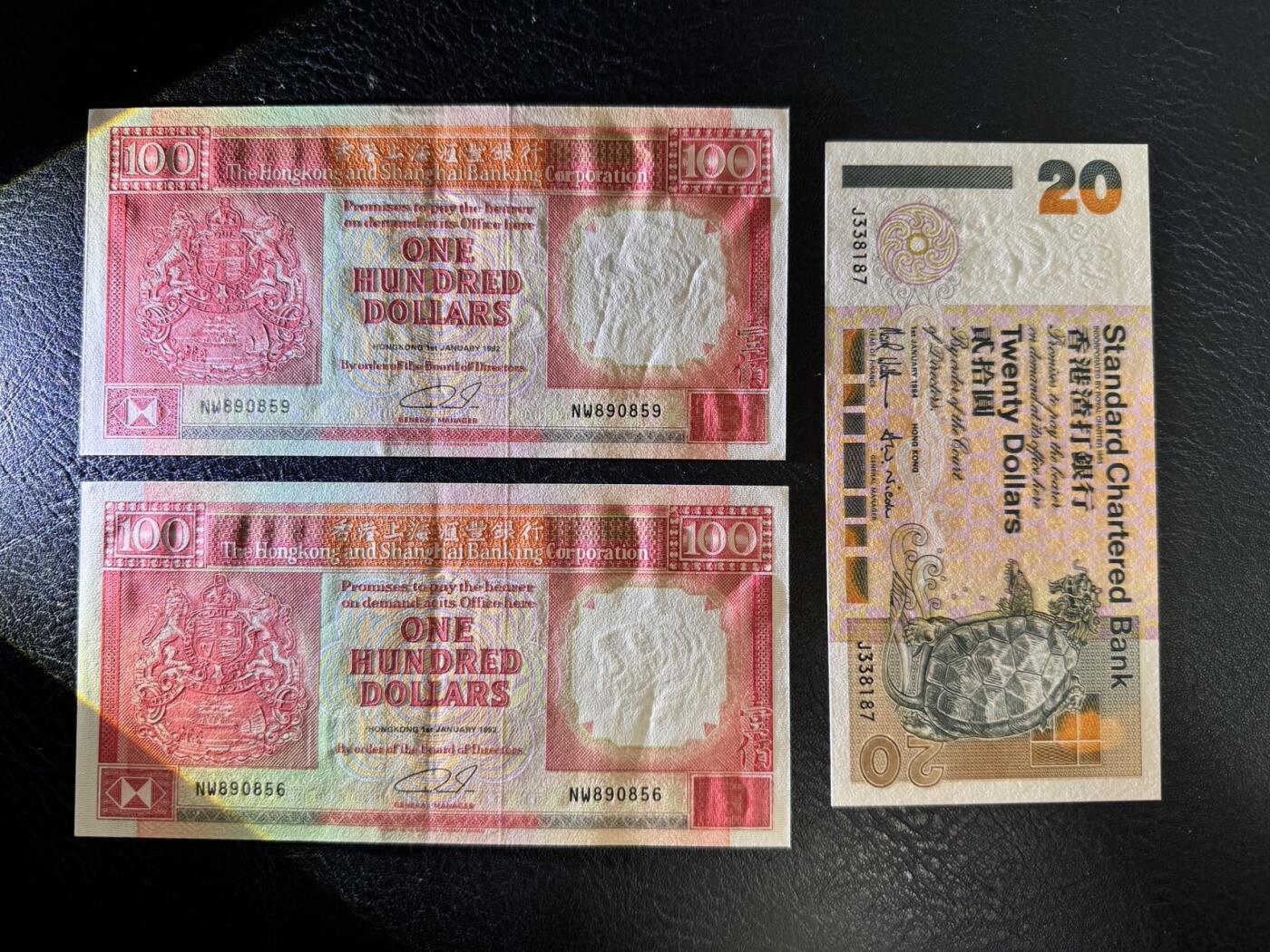 收藏联盟Quantum Auction 第358期拍卖  香港汇丰银行1992年100元两张和渣打银行1994年20元 品相100为AU 20为全新UNC