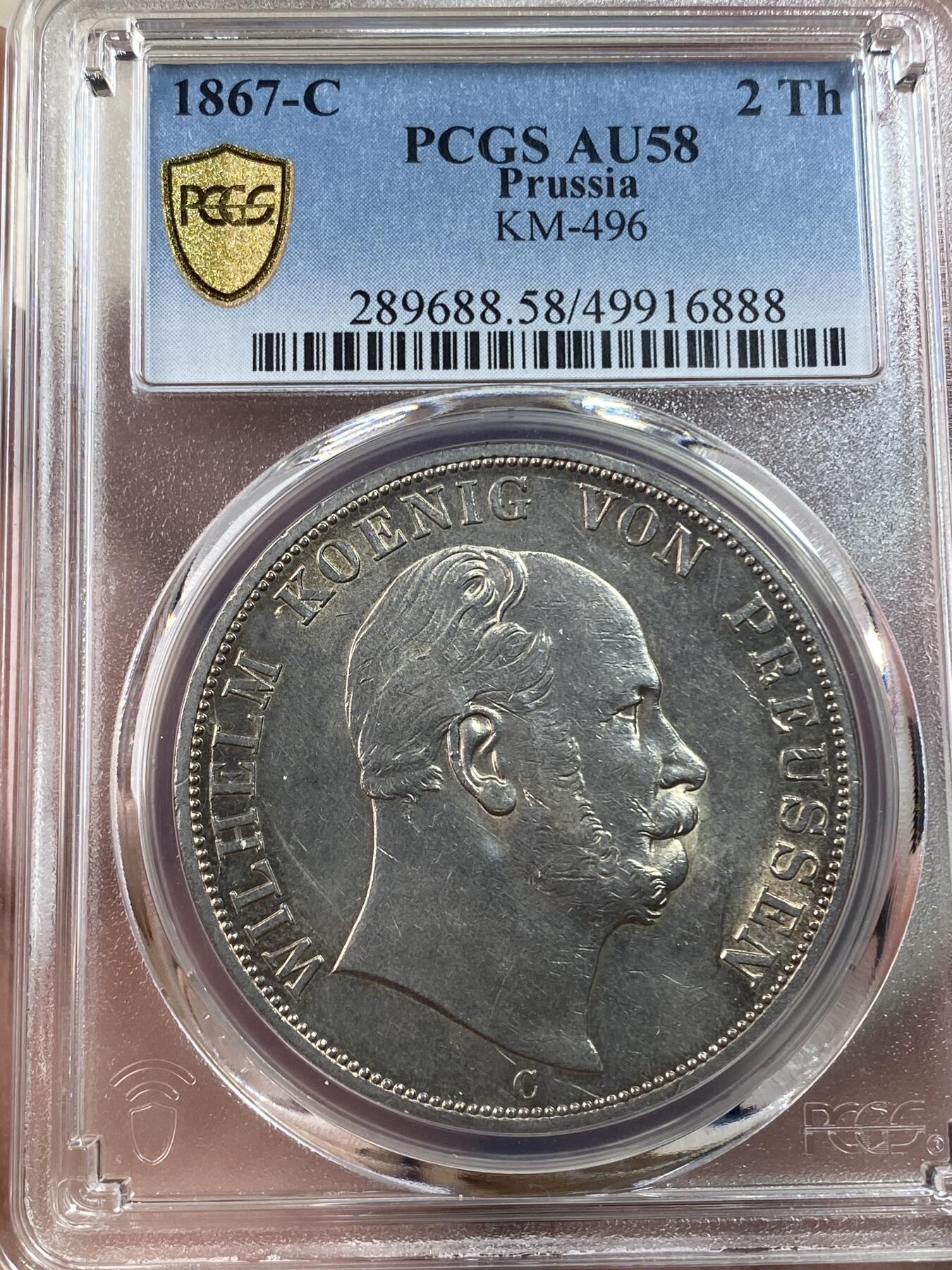 万国钱币拍卖第030期（万国三十期纪念大拍） PCGS AU58 1867年德国普鲁士威廉一世大鸟2泰勒 深打原味暗金彩 实物转光状态极赞