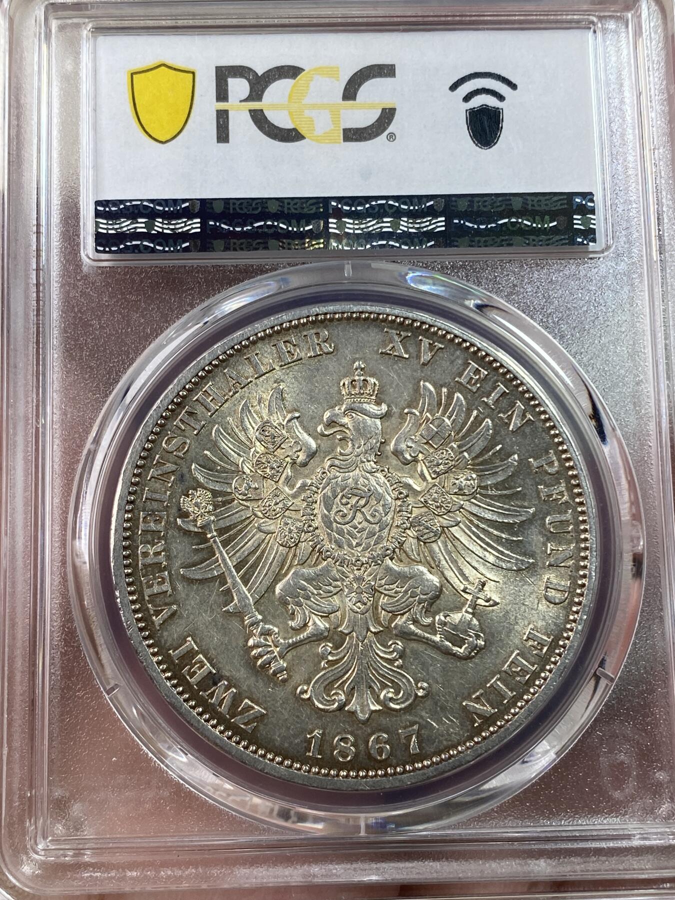 万国钱币拍卖第030期（万国三十期纪念大拍） PCGS AU58 1867年德国普鲁士威廉一世大鸟2泰勒 深打原味暗金彩 实物转光状态极赞