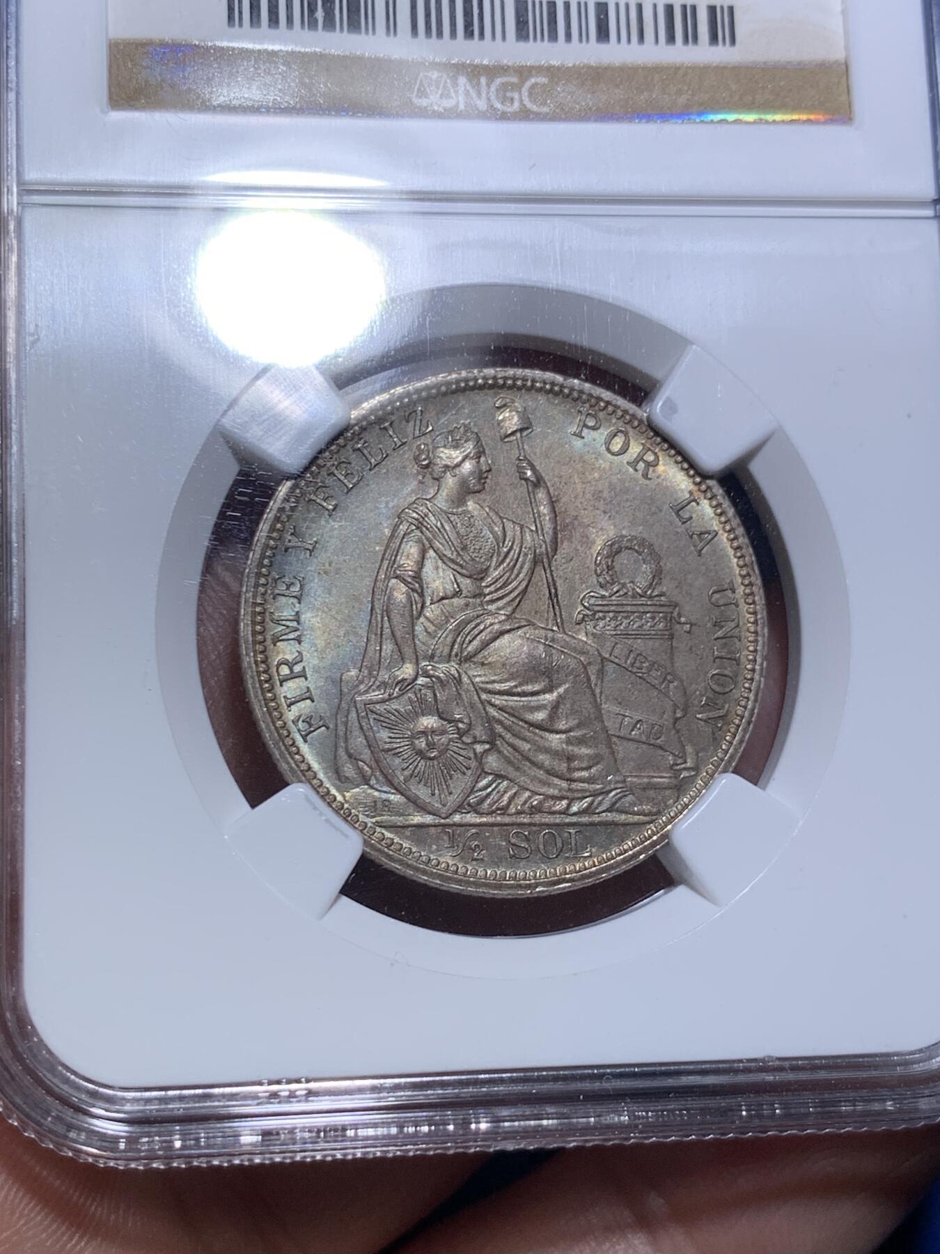 《竞宝斋》第289场- 周日，周一，周二 3场连拍 （全场包邮） NGC MS64 秘鲁1914年坐人女神半索尔银币 半圆大小，经典女神坐像。卷首币，正面浓郁深五彩，背面银光粉润，老N盒严评