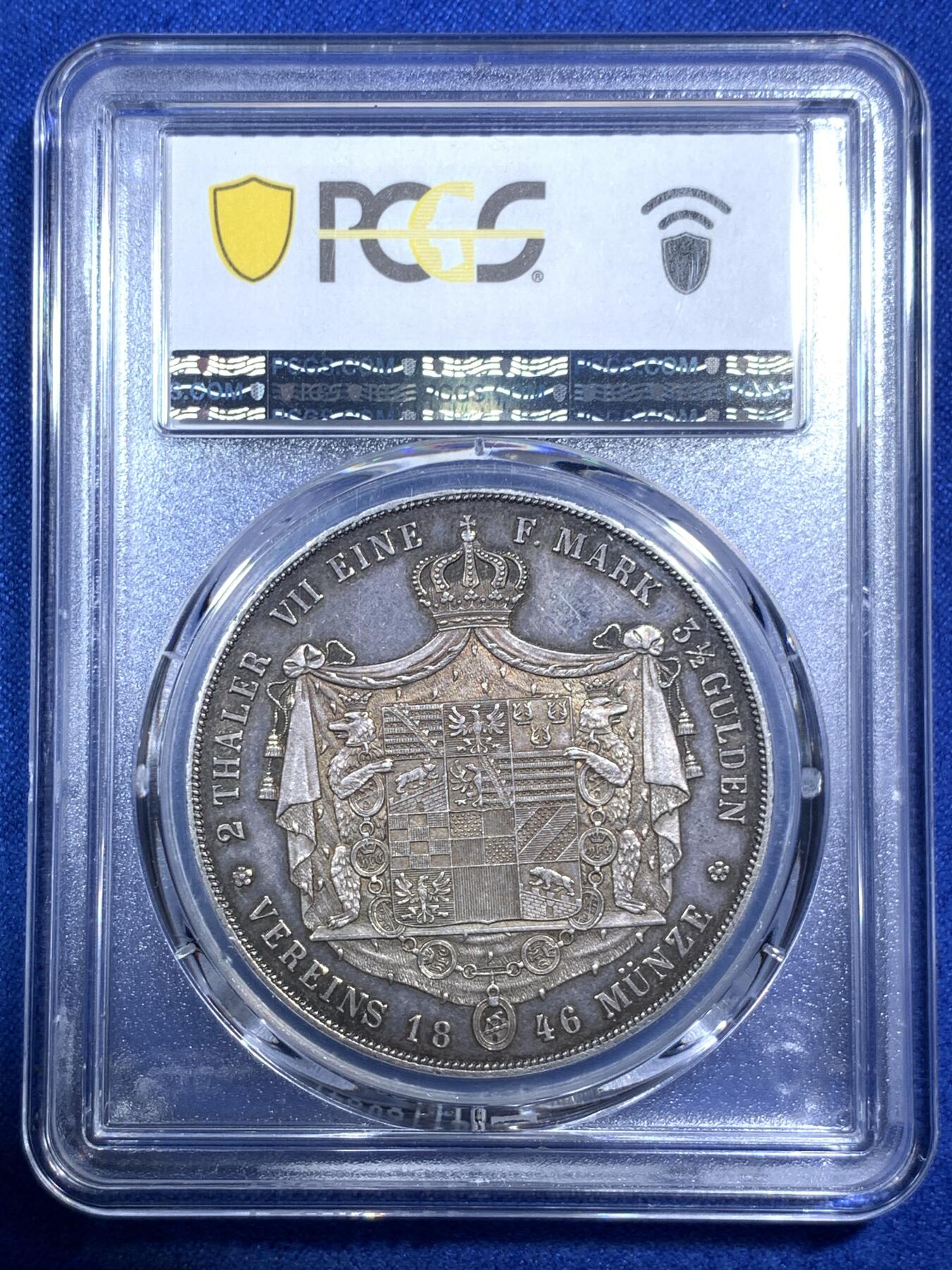 《竞宝斋》第289场- 周日，周一，周二 3场连拍 （全场包邮） PCGS AU58 德国 安哈尔特-德绍双协定泰勒 重37.12g 直径40.8mm 含银90% 正面是安哈尔特利奥波德.腓特烈公爵头像，头像上有一圈德文，其意为“安哈尔特利奥波德.腓特烈公爵”，下标A表示是柏林铸币厂制造；背面“2 THALER VII EINE F.MARK 3 1/2 GLUDEN VEREINS MÜNZE 1846