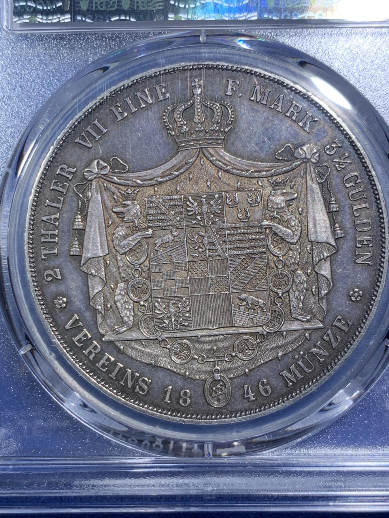 《竞宝斋》第289场- 周日，周一，周二 3场连拍 （全场包邮） PCGS AU58 德国 安哈尔特-德绍双协定泰勒 重37.12g 直径40.8mm 含银90% 正面是安哈尔特利奥波德.腓特烈公爵头像，头像上有一圈德文，其意为“安哈尔特利奥波德.腓特烈公爵”，下标A表示是柏林铸币厂制造；背面“2 THALER VII EINE F.MARK 3 1/2 GLUDEN VEREINS MÜNZE 1846