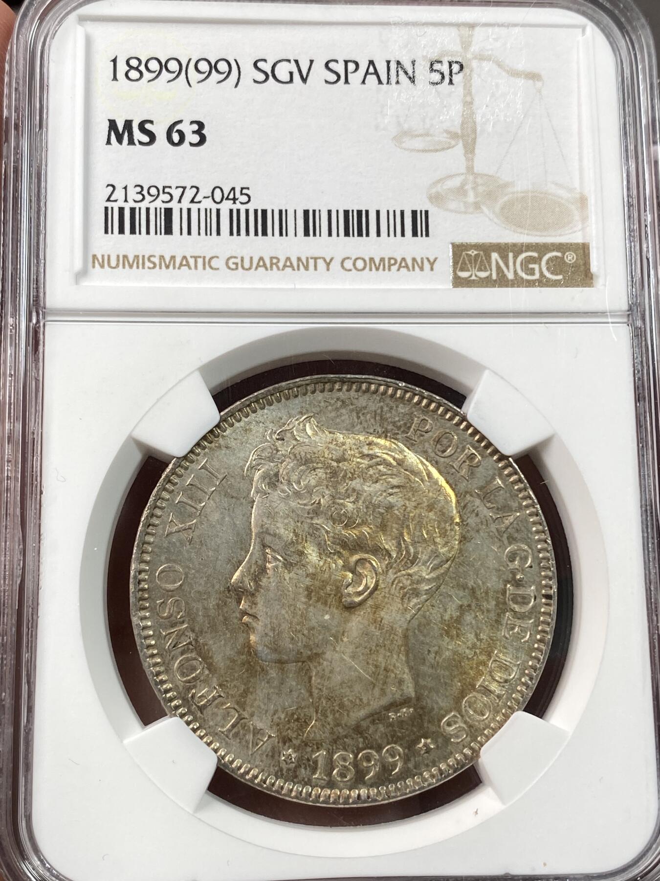 万国钱币拍卖第030期（万国三十期纪念大拍） NGC MS63 1899年西班牙阿方索十三世小孩头5比塞塔大银币 流通非常充分的品种 淡金彩包浆