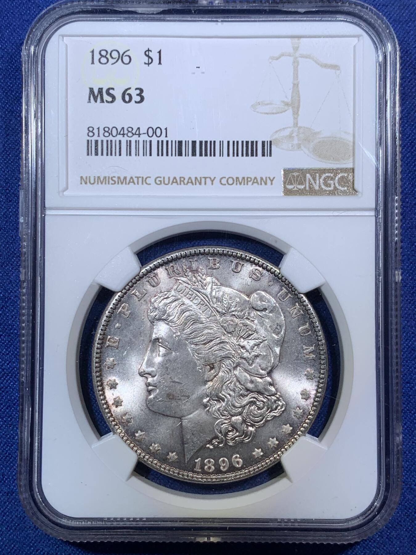 《竞宝斋》第292场- 周日，周一  2场连拍 （全场包邮） NGC MS63 美国1896摩根 绝对低评 包浆非常漂亮 蓝色和紫色交织在币面上 配合闪闪的银光 实属自藏佳品