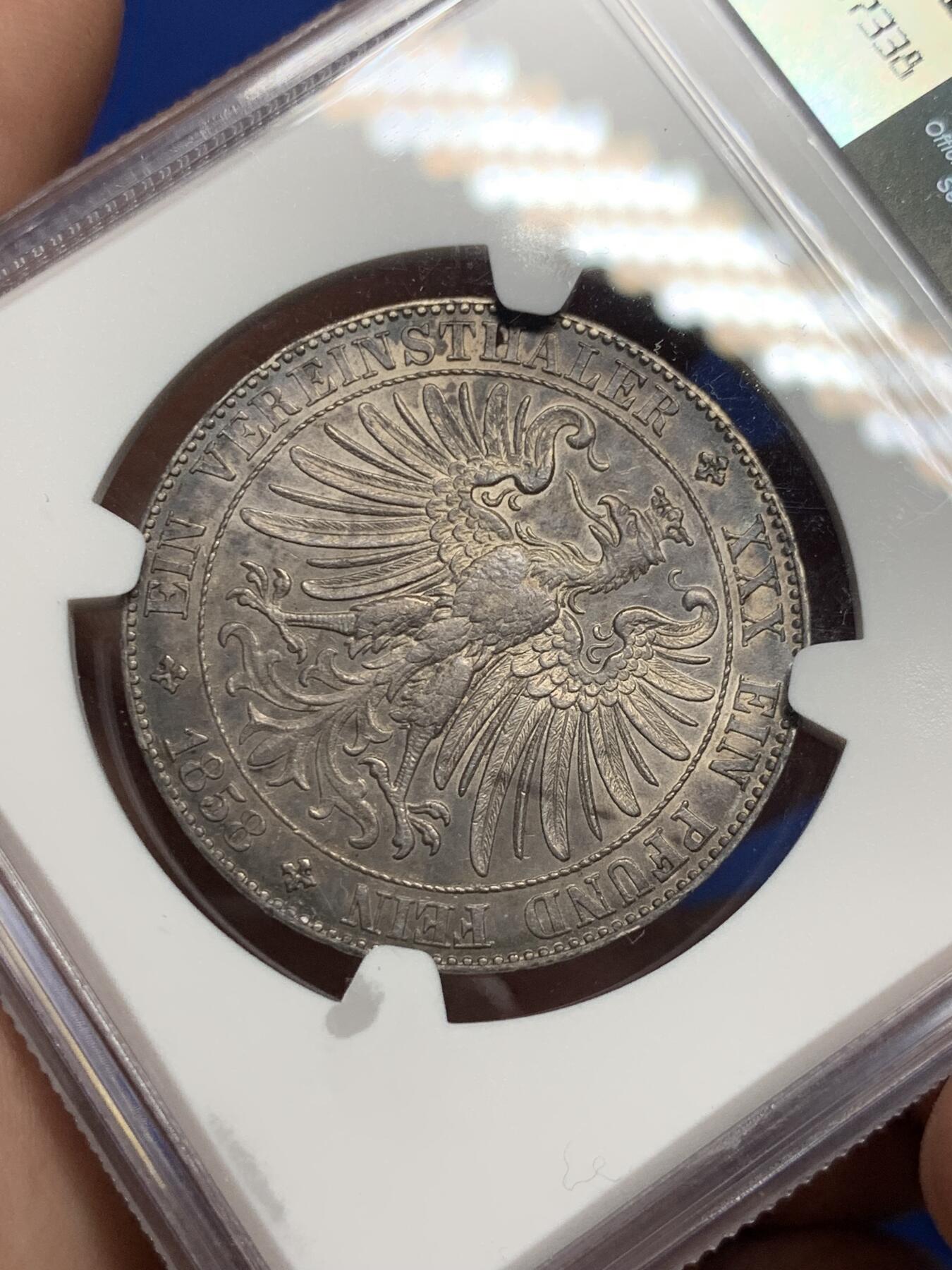 《竞宝斋》第292场- 周日，周一  2场连拍 （全场包邮） NGC AU58 德国法兰克福 1858年 稀少教堂版 法兰克福少女 1泰勒银币 深彩包浆光度好