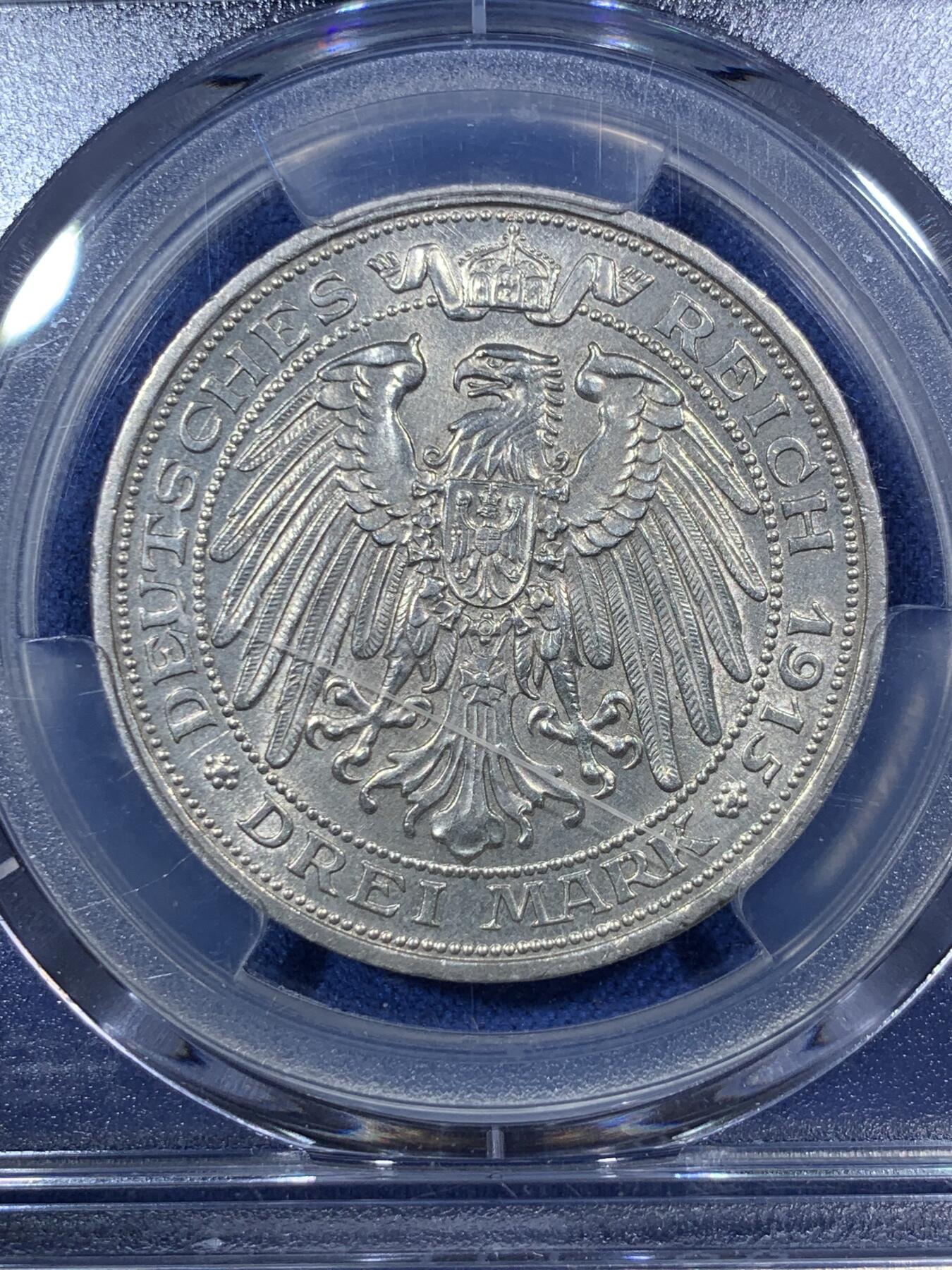 《竞宝斋》第292场- 周日，周一  2场连拍 （全场包邮） PCGS MS64 德国普鲁士1915曼斯菲尔德屠龙3马克银币 背面盒子上有一划痕