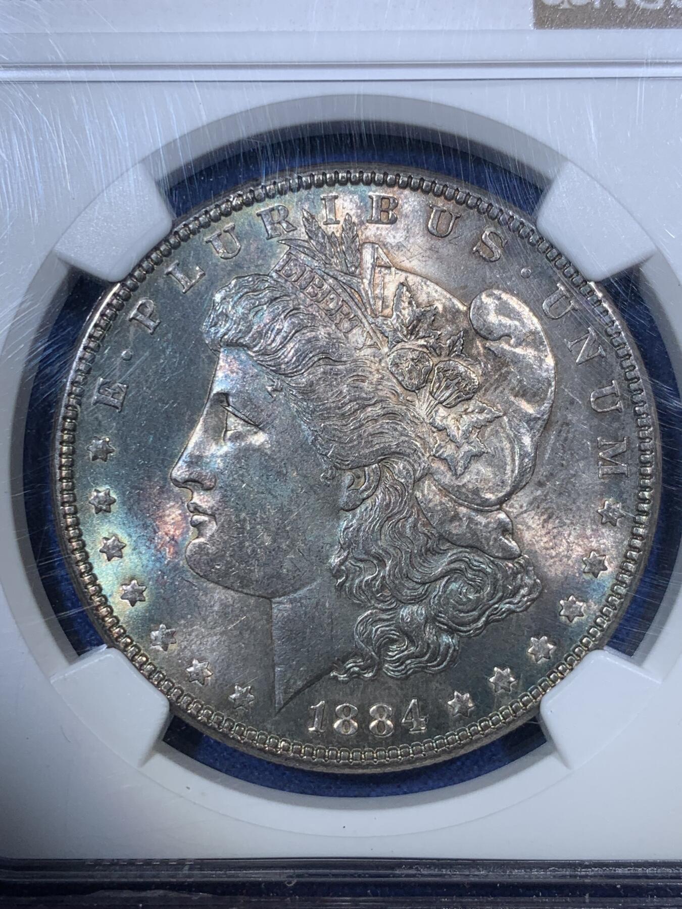 《竞宝斋》第292场- 周日，周一  2场连拍 （全场包邮） NGC MS62 美国 1884年 摩根1美元 孔雀蓝包浆 较少的年份