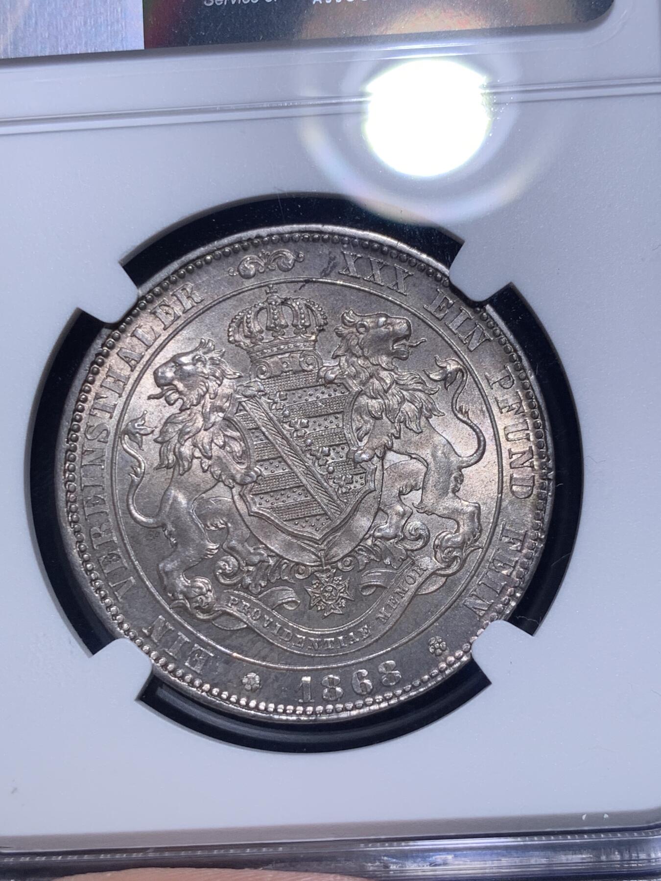 《竞宝斋》第294场- 周日，周一  2场连拍 （全场包邮） NGC MS62  德国 1868 萨克森 双狮流通1联合泰勒银币 紫罗兰包浆带十字光