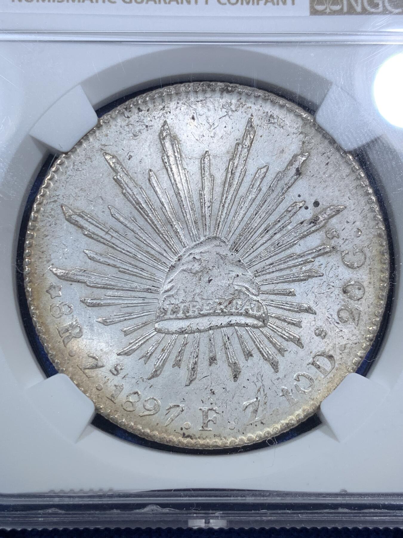 《竞宝斋》第295场- 周日，周一  2场连拍 （全场包邮） NGC MS63 1897年墨西哥鹰洋8R 滴水未沾的原始状态，原银光，老鹰羽毛细节非常好，可惜背面包浆减分，不然定能更上一层楼